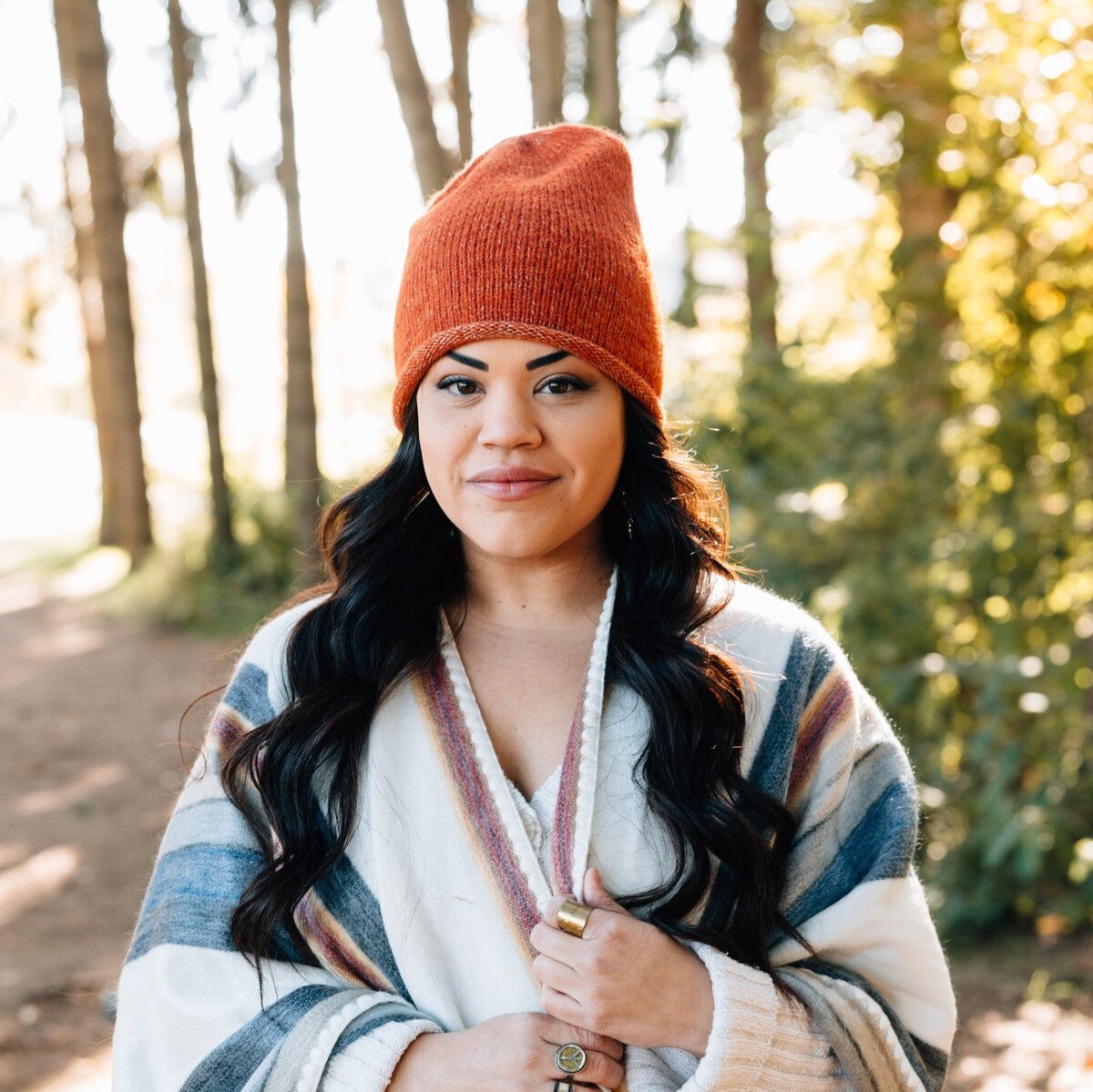 Model wearing the stylish slouchy hat for men and women in a winter setting.