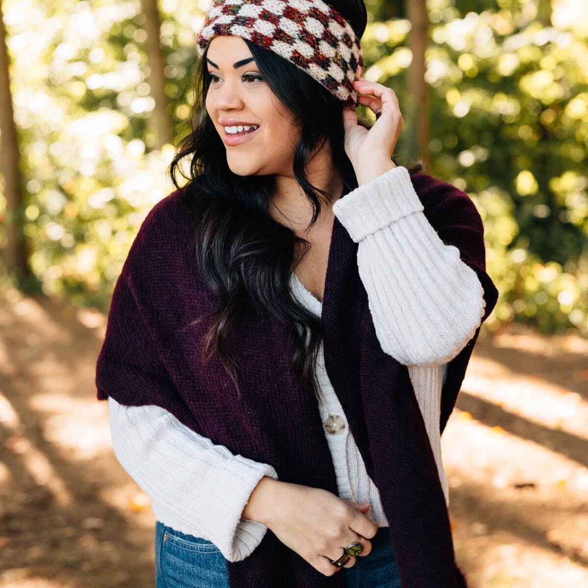 Front view of burgundy alpaca triangle shawl draped over shoulders, showcasing its rich color and texture
