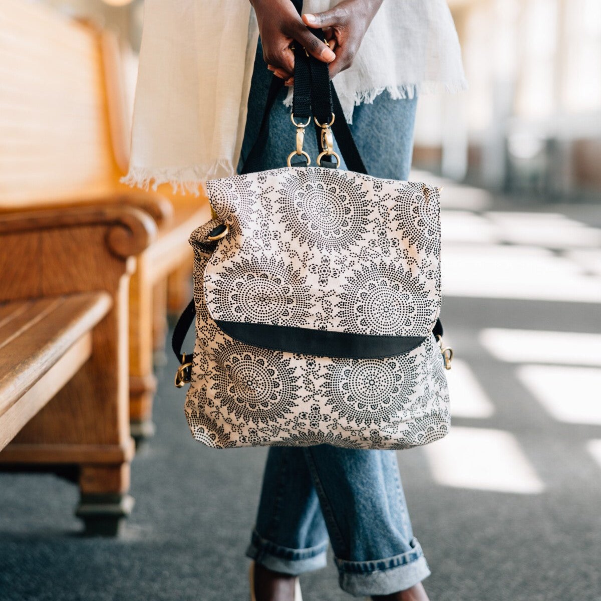 Chic Travel Mandala Backpack from the side, showcasing its adjustable straps and vibrant colors.