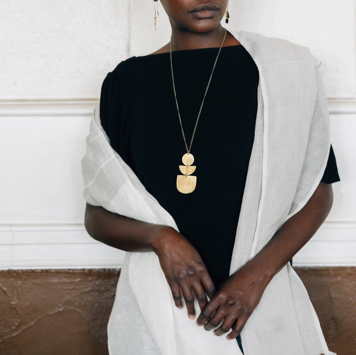 Model wearing the Gossamer scarf styled with a casual outfit, perfect for spring.
