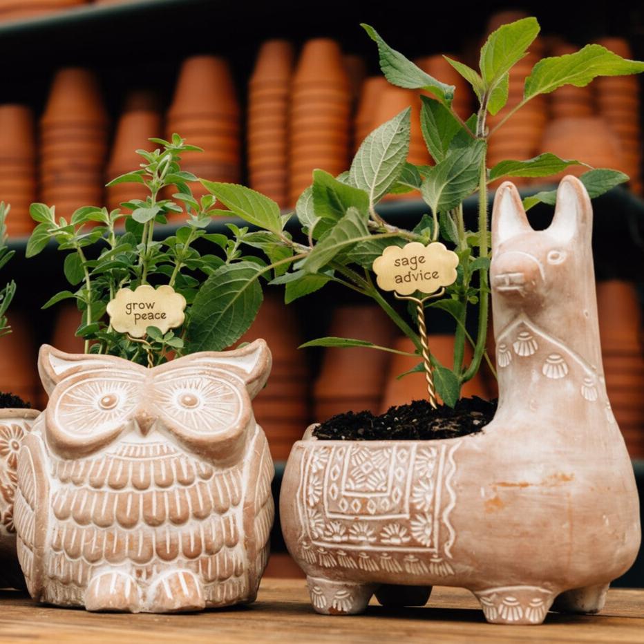 Side angle of decorative planter showing detailed artisan craftsmanship and texture