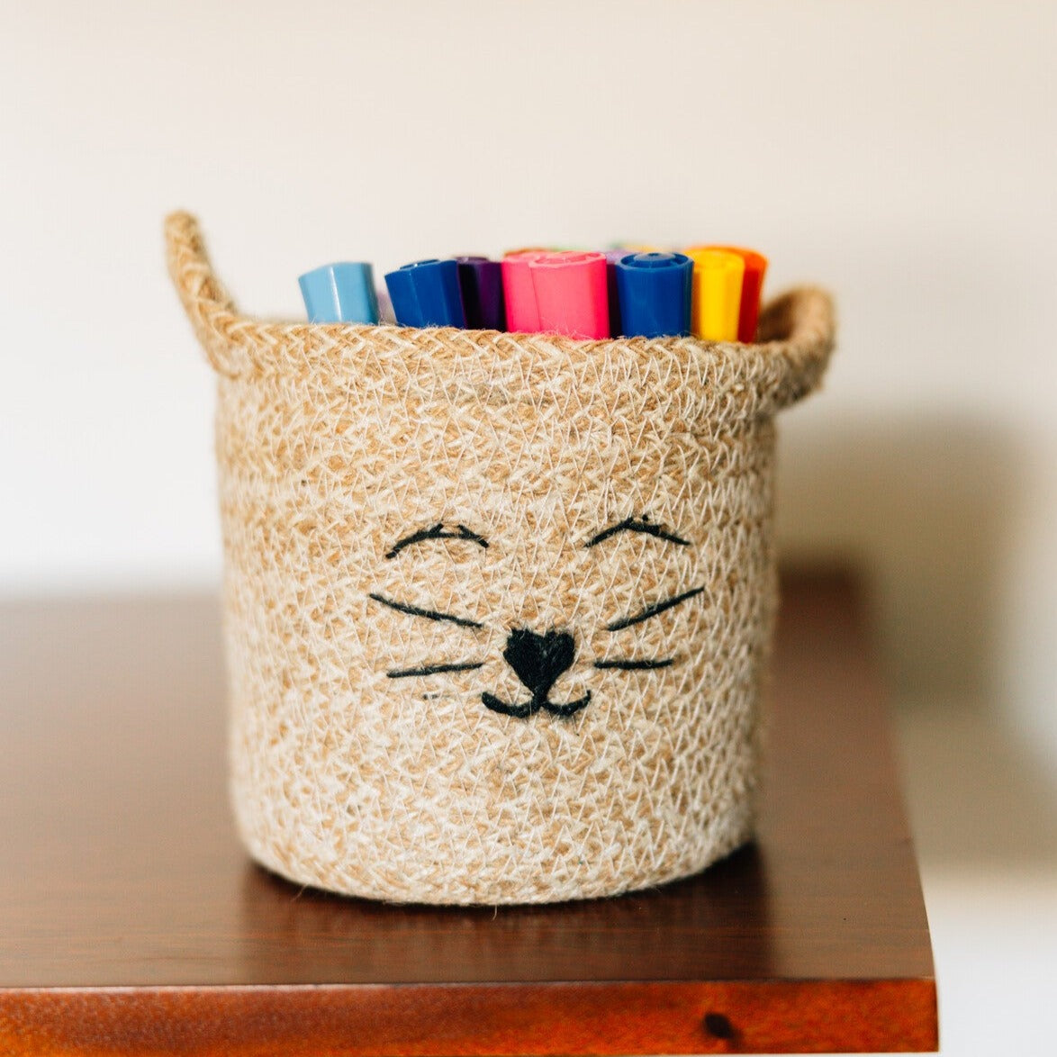 Versatile jute basket filled with toys, showcasing its use as a storage solution for kids rooms.