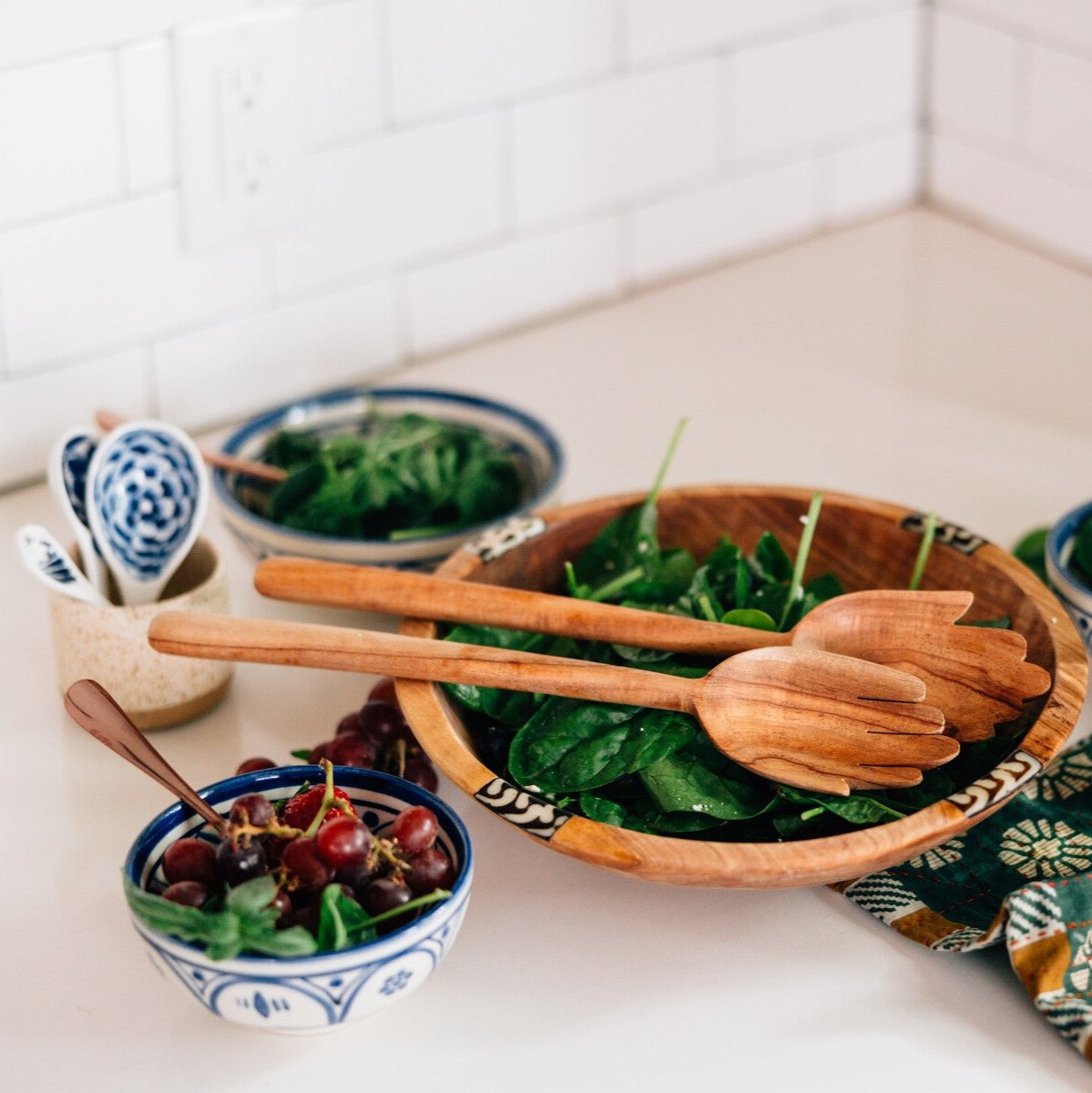 Artisan serving bowl displayed with assorted fruits, highlighting its elegant design.