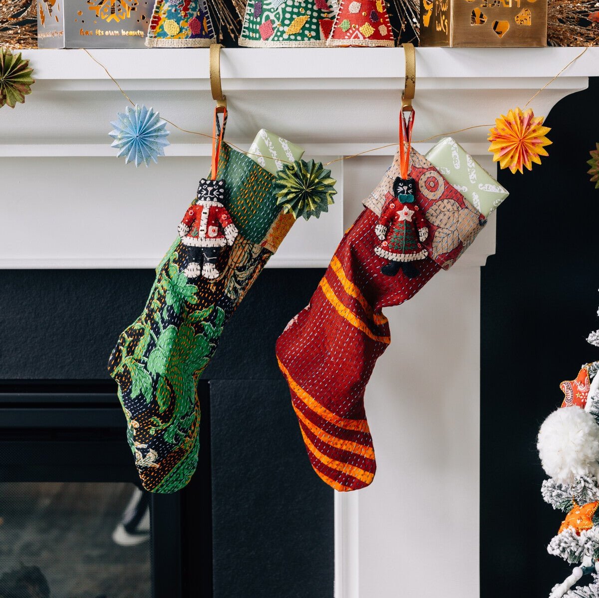 Artisan Kantha stitched stocking showcasing vibrant colors and patterns, perfect for festive decor.