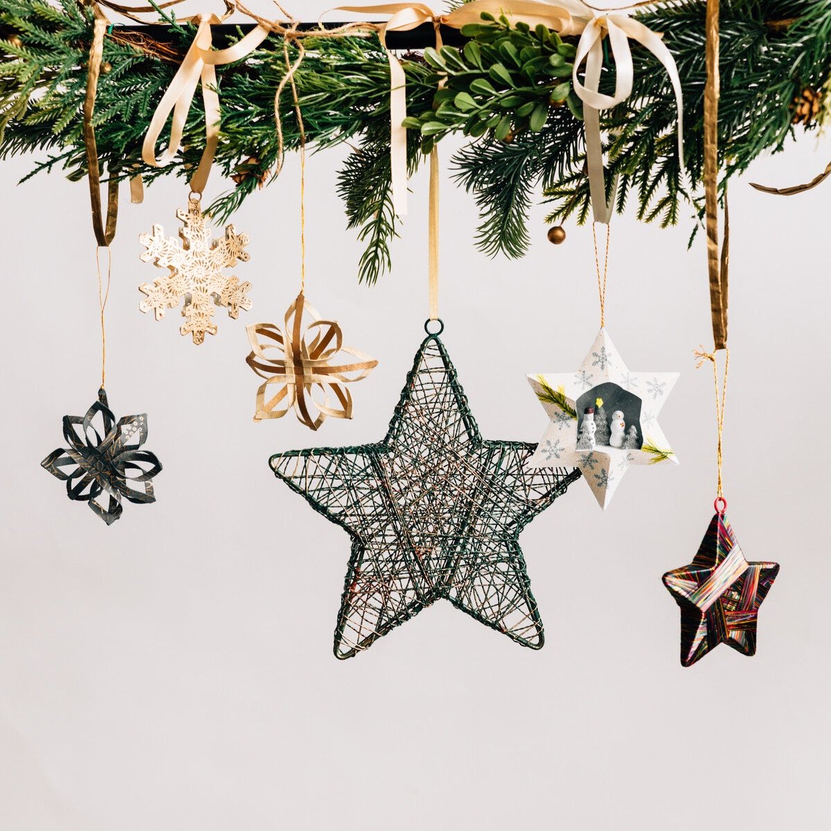 Elegant gold star Christmas ornament displayed on a beautifully decorated tree.