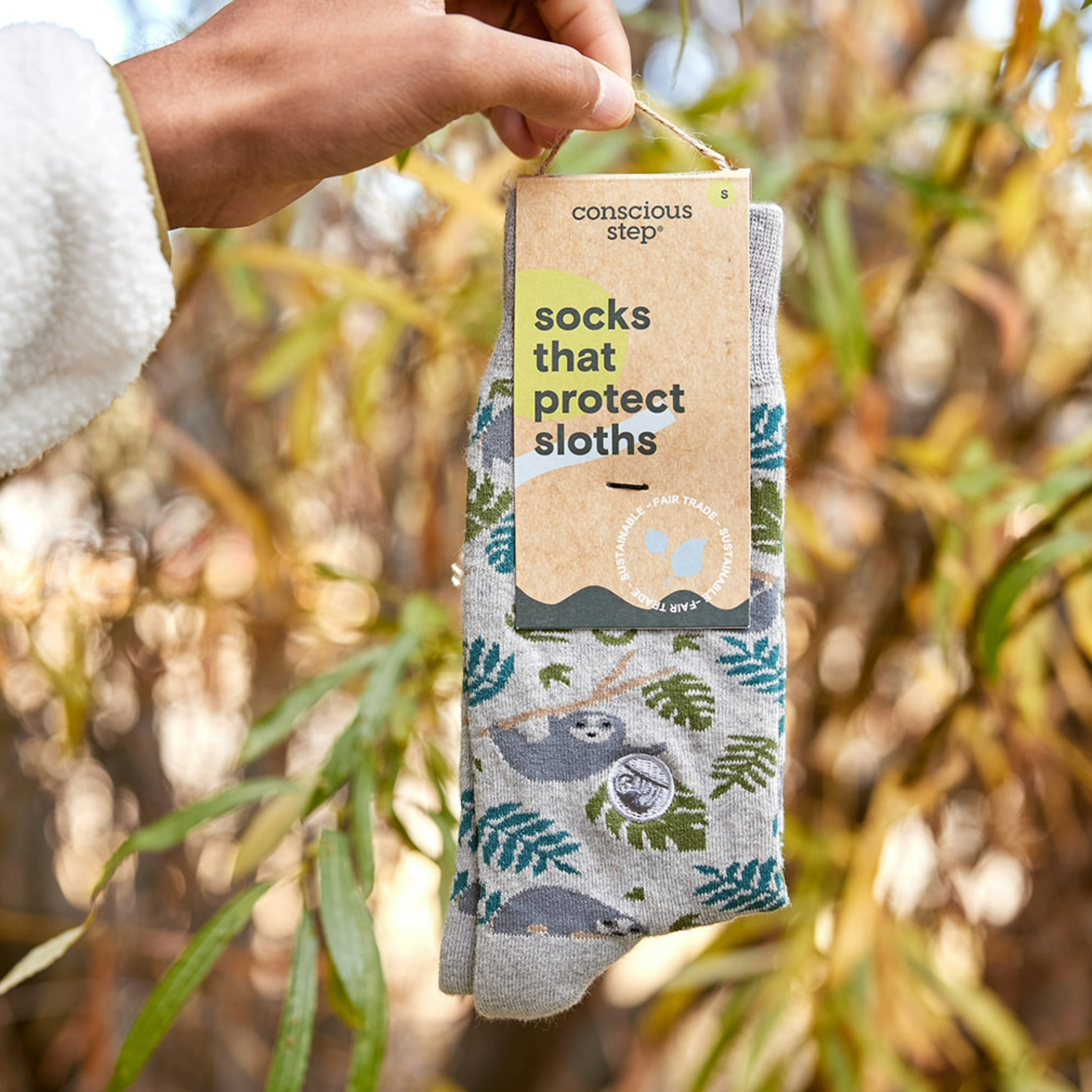 Eco-friendly socks with a sloth design, showcasing their vibrant pattern and comfort.