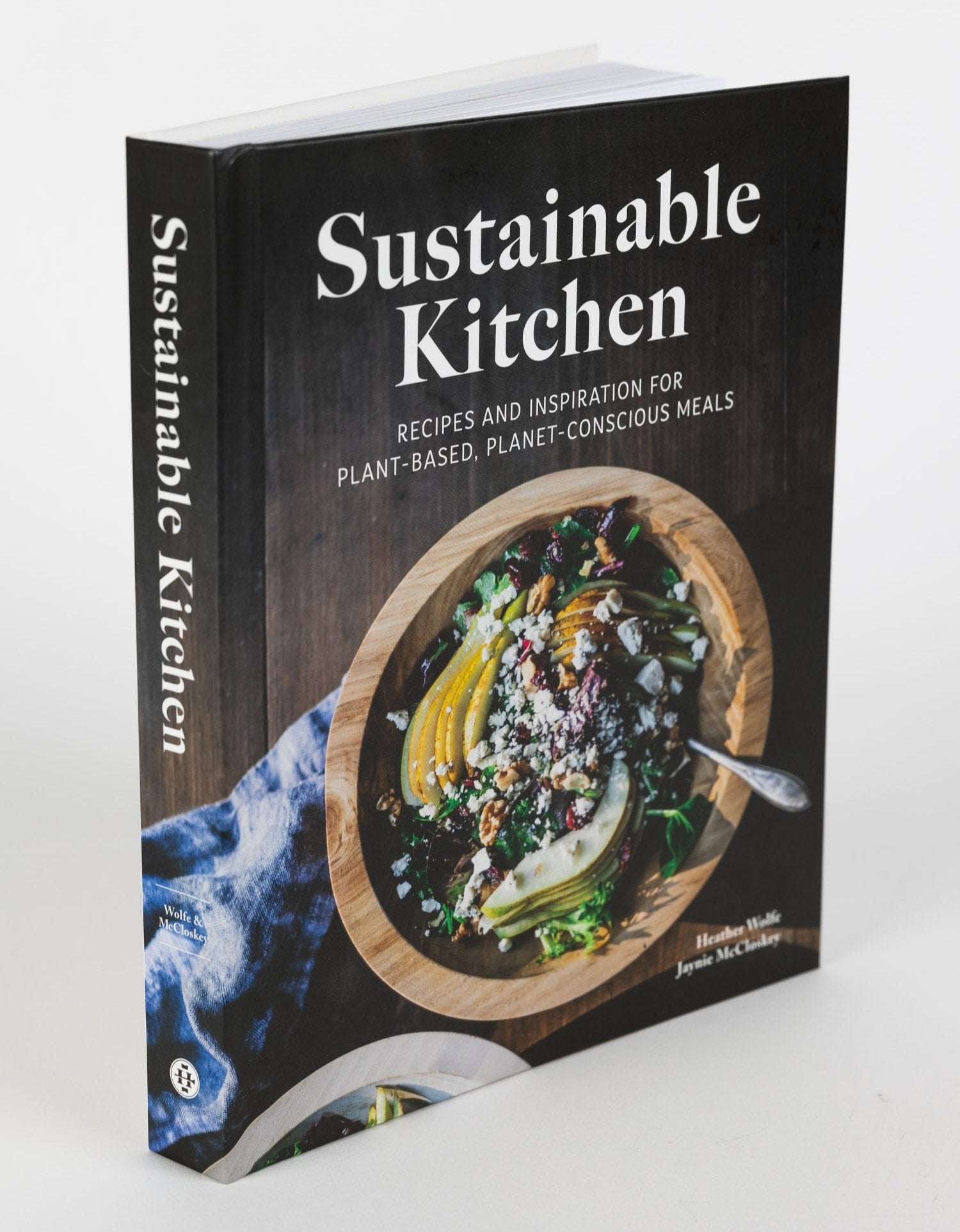 Cover of Eco-Friendly Family Meals cookbook showcasing vibrant plant-based dishes.