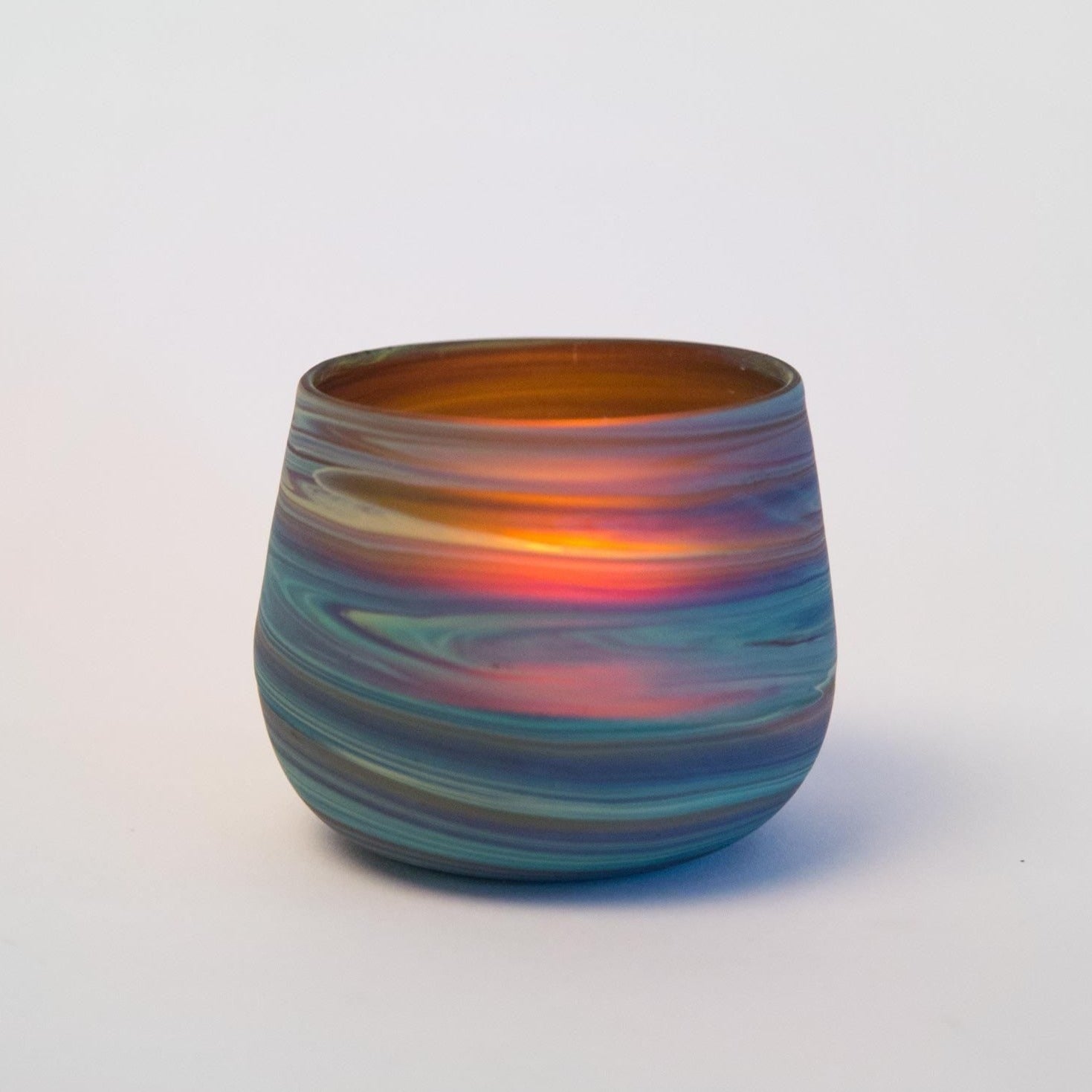 Unique Phoenician glass candleholder showcasing vibrant colors and patterns, ideal for home decor.