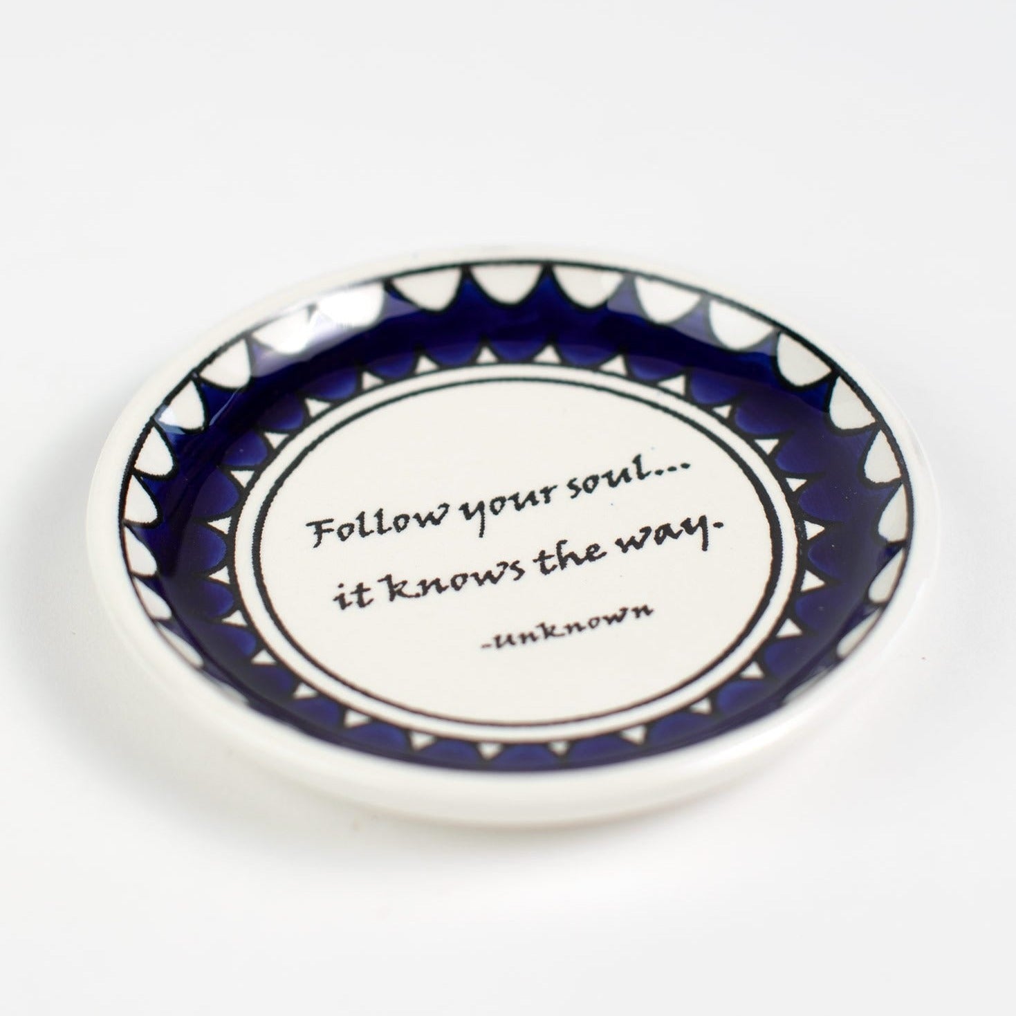 Angle view of the Inspire Your Journey Ceramic Dish showcasing its unique design and color.
