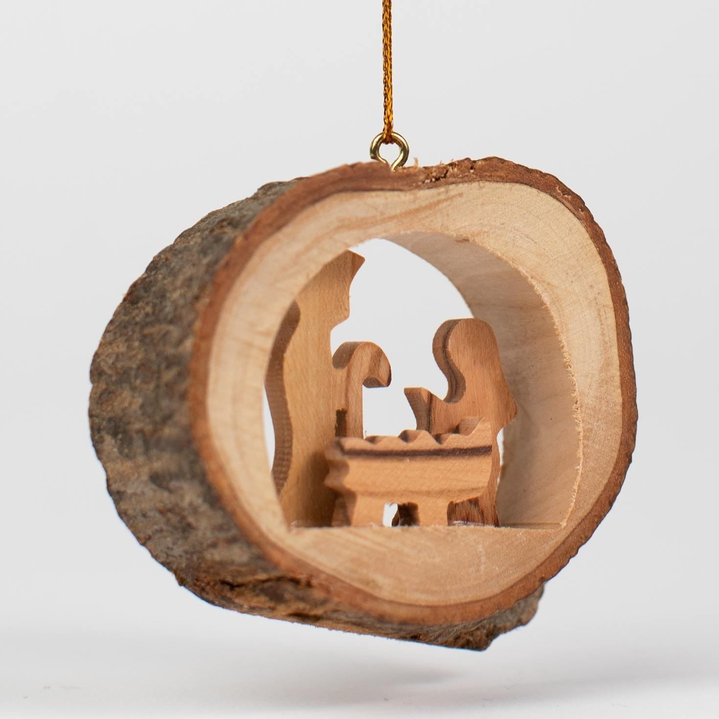 Handmade olive branch ornament hanging on a Christmas tree, adding a peaceful touch to the decor.