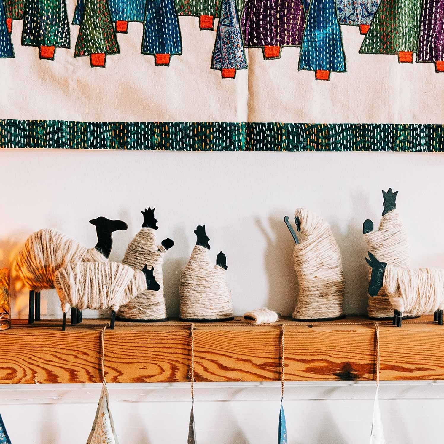Close-up of the elegant wrapped wool nativity scene showcasing the details of each figure.