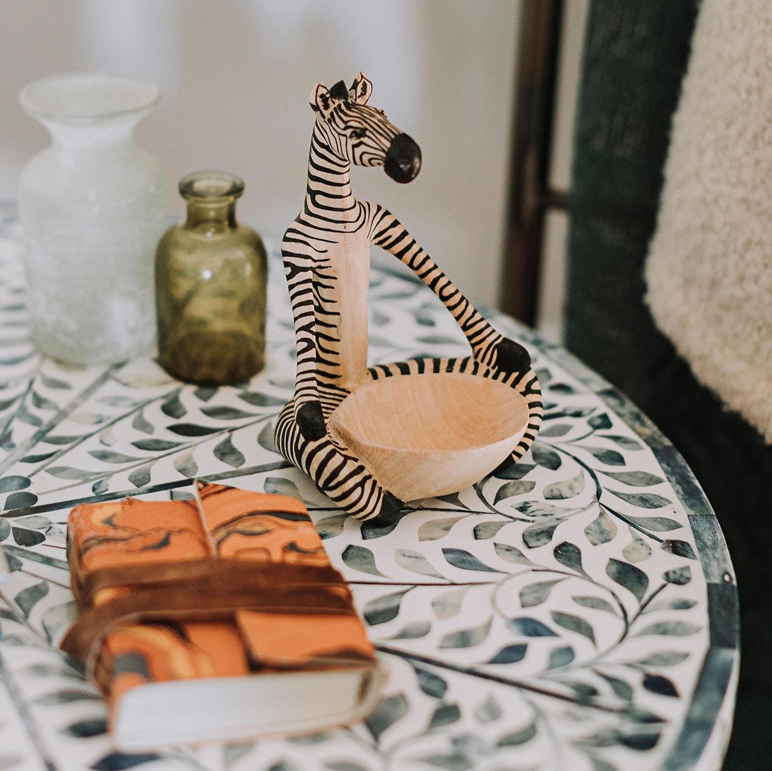 Handcrafted wooden animal jewelry bowl with detailed carvings, perfect for jewelry storage