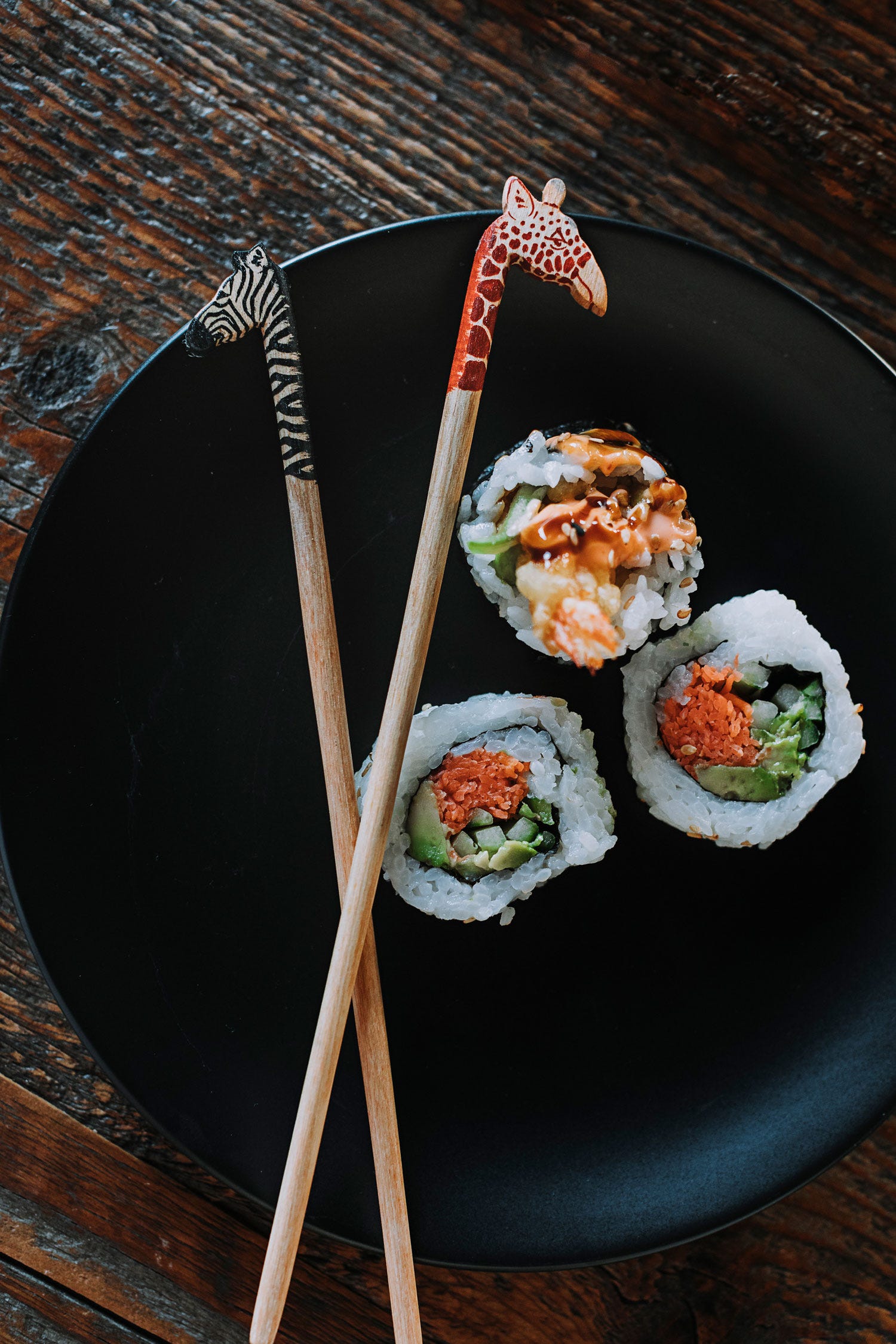 Elegant zebra chopsticks showcasing intricate design, perfect for Asian cuisine enthusiasts.