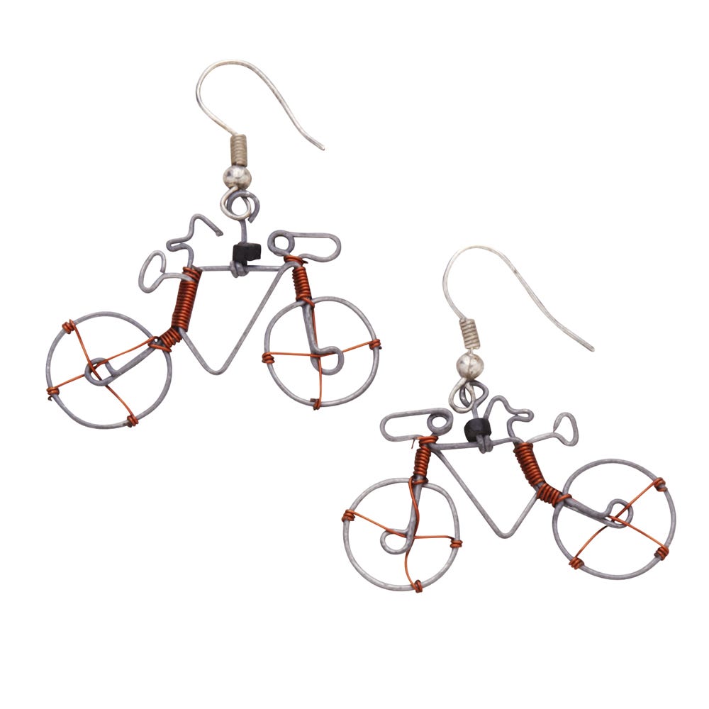 Close-up of handmade wire bicycle earrings showing detailed craftsmanship