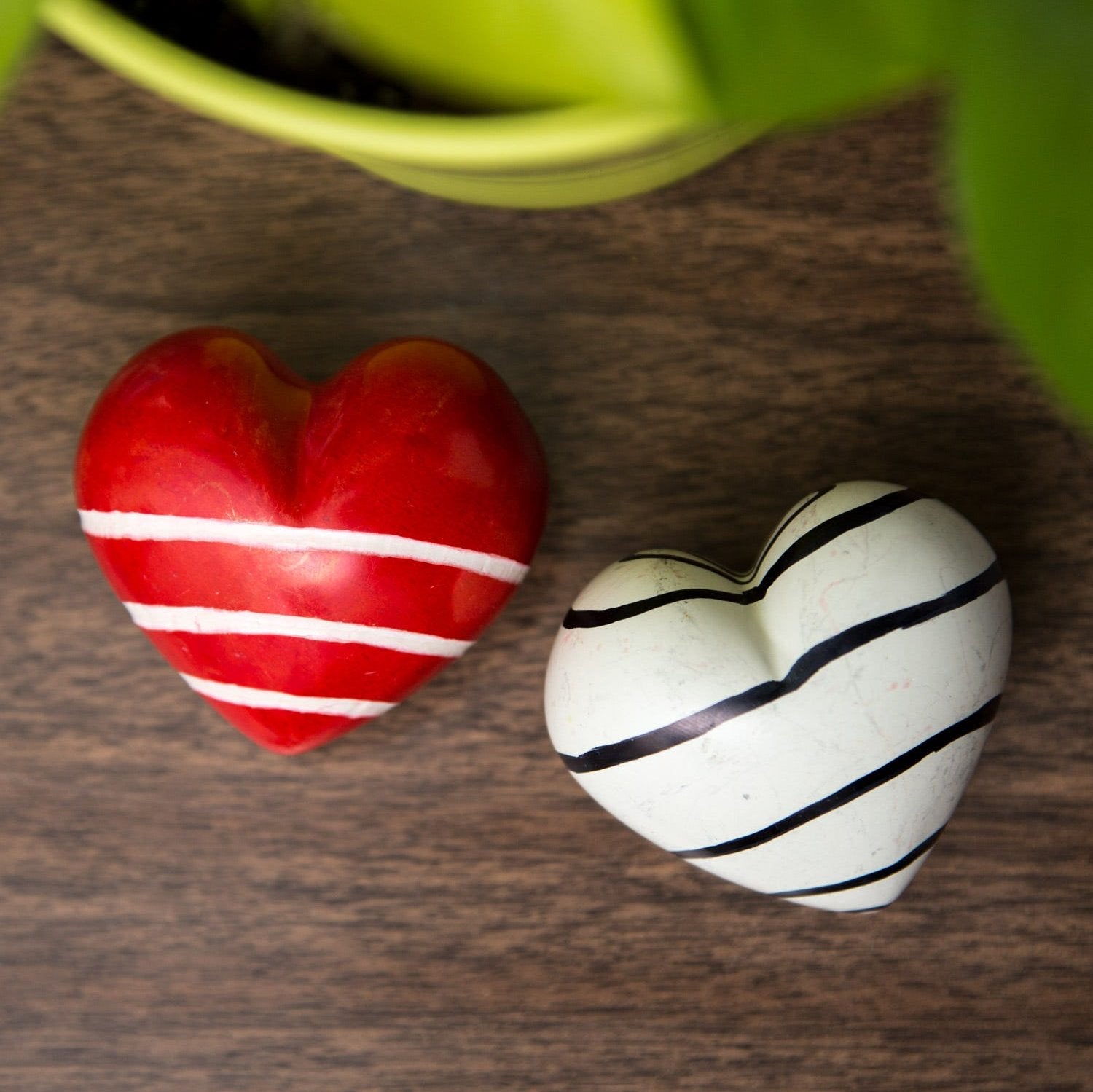 Kisii stone love paperweight showcasing intricate patterns and smooth finish.