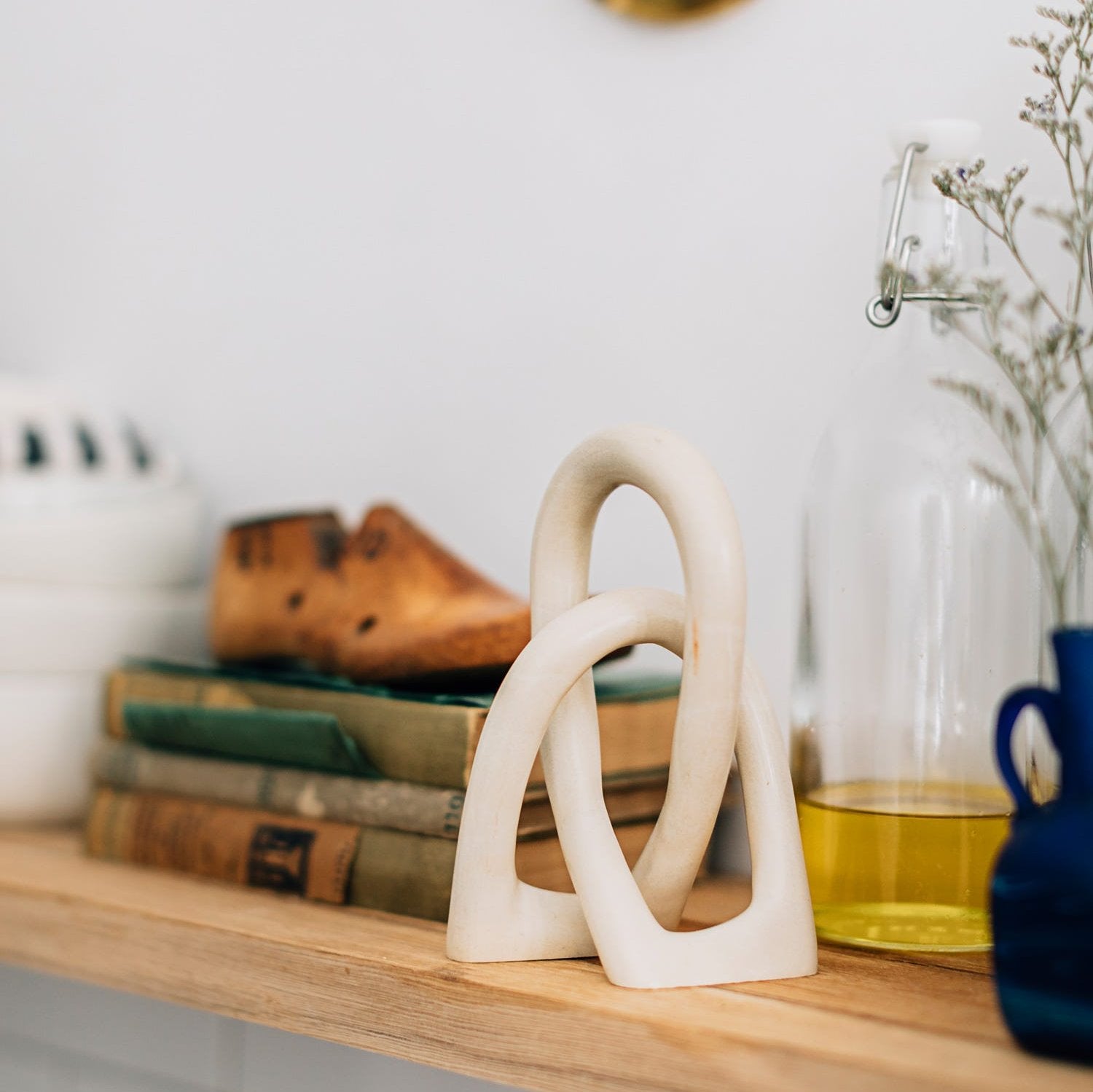 Eternal Unity Sculpture displayed on a coffee table, showcasing its elegant design and symbolism of marriage.