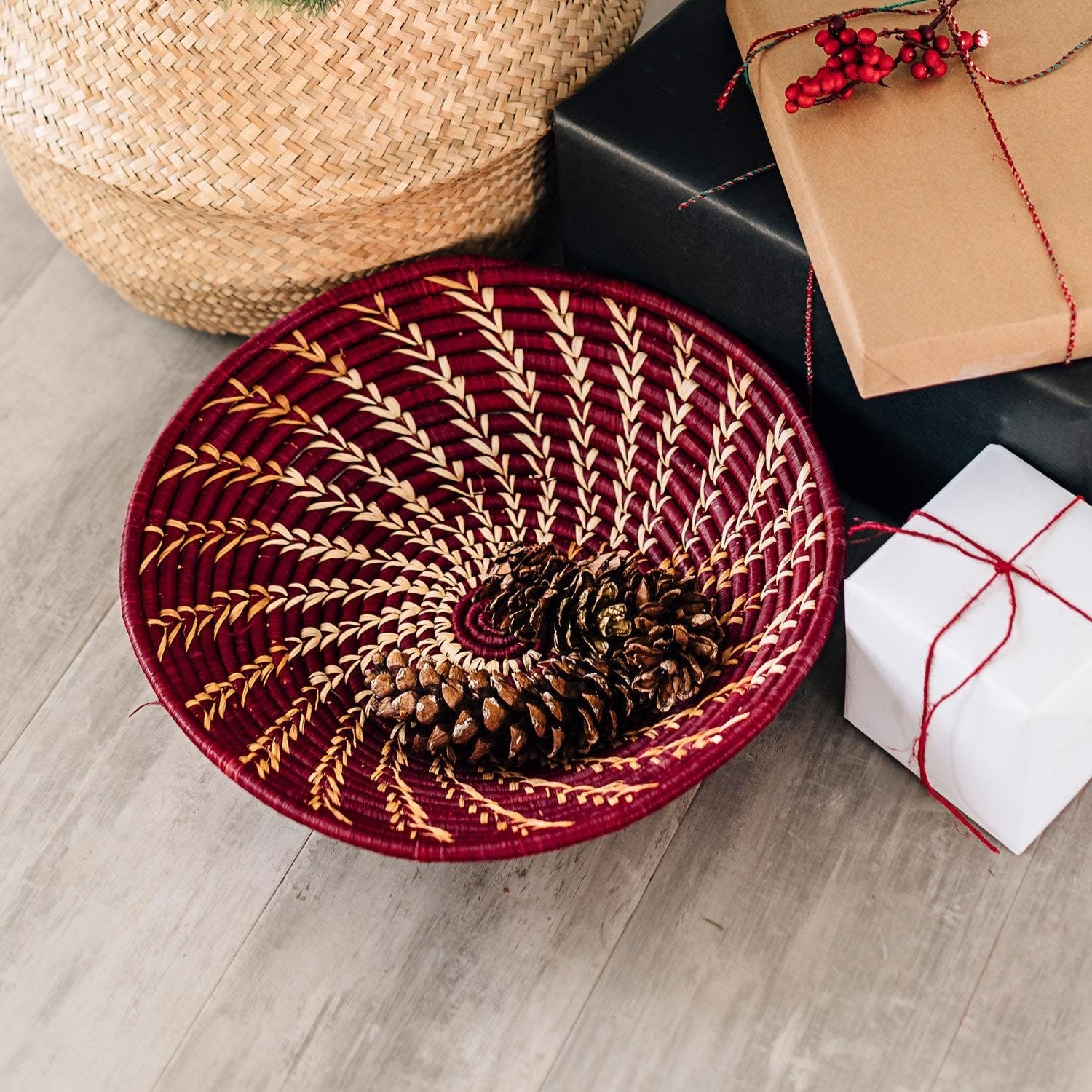 Burgundy Artisan Twist Basket showcasing its intricate design and vibrant colors, ideal for decorative storage.