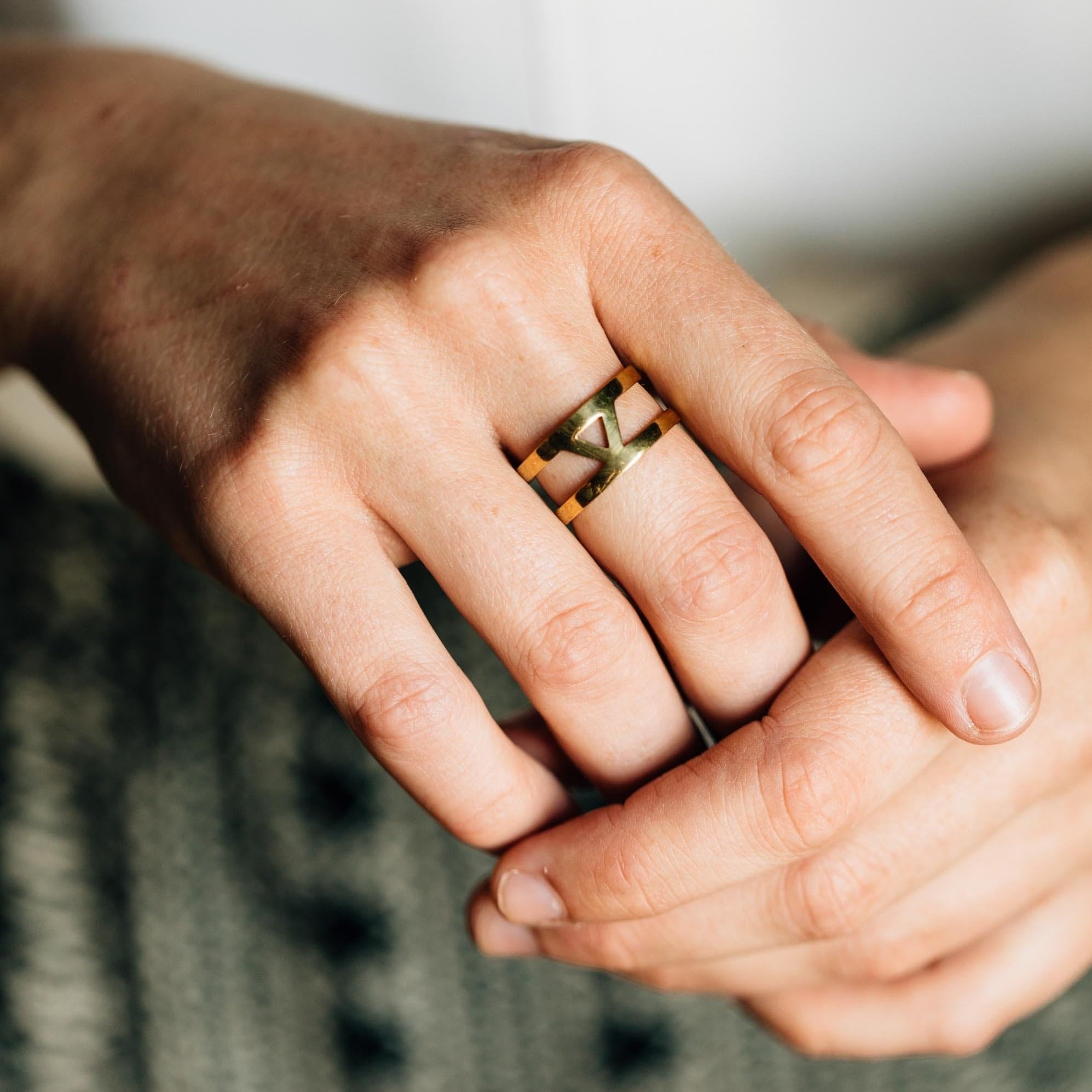 Close-up of the eco-friendly brass triangle cuff ring highlighting its unique craftsmanship.