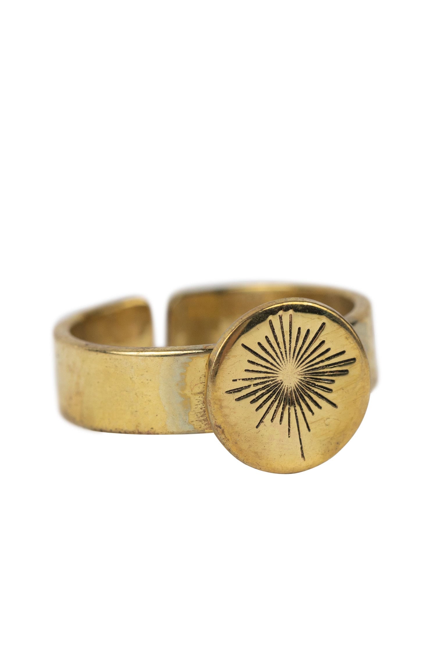 Guiding Star Ring displayed from the side, highlighting its unique brass design.