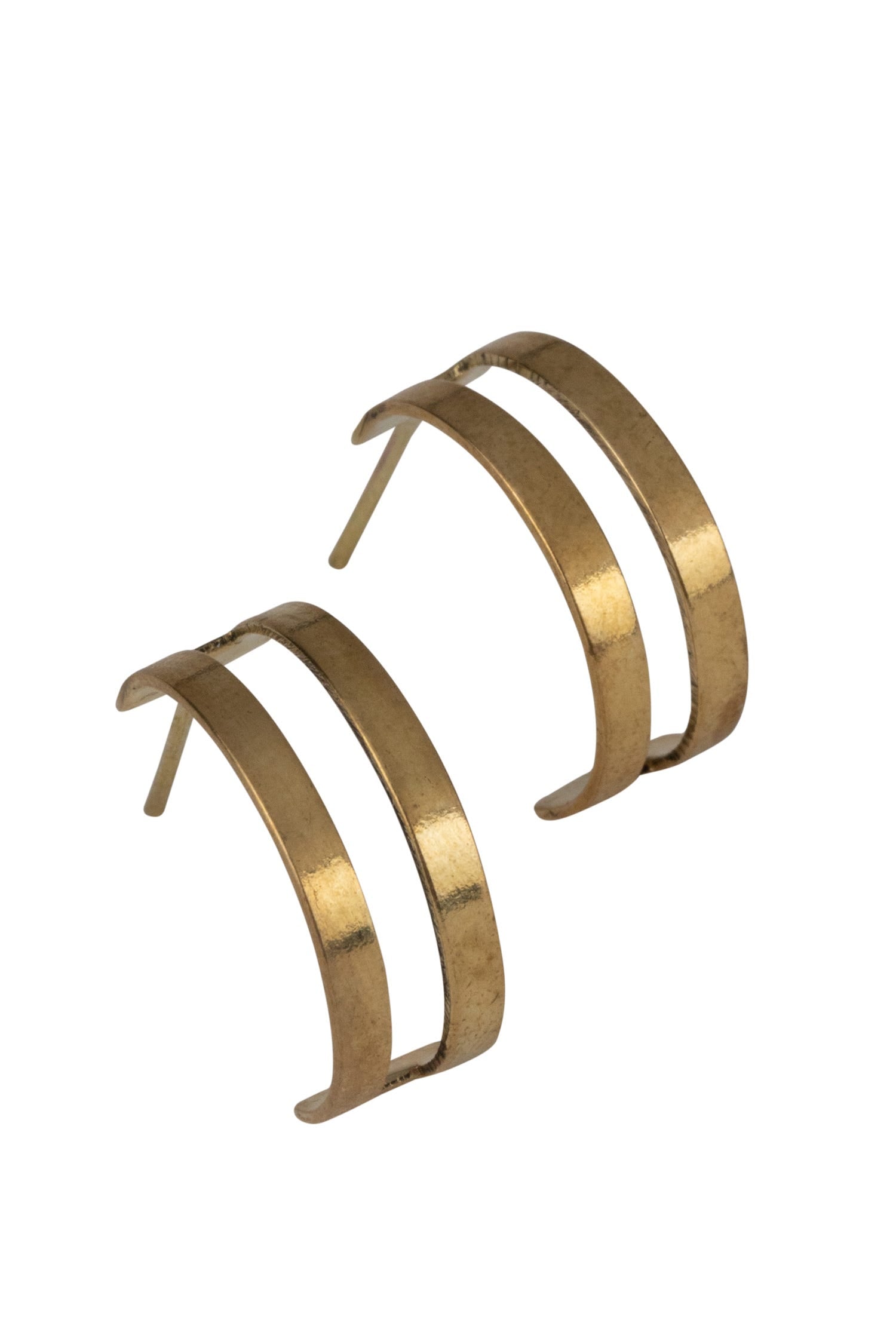 Handcrafted hoop earrings made from recycled brass, side view
