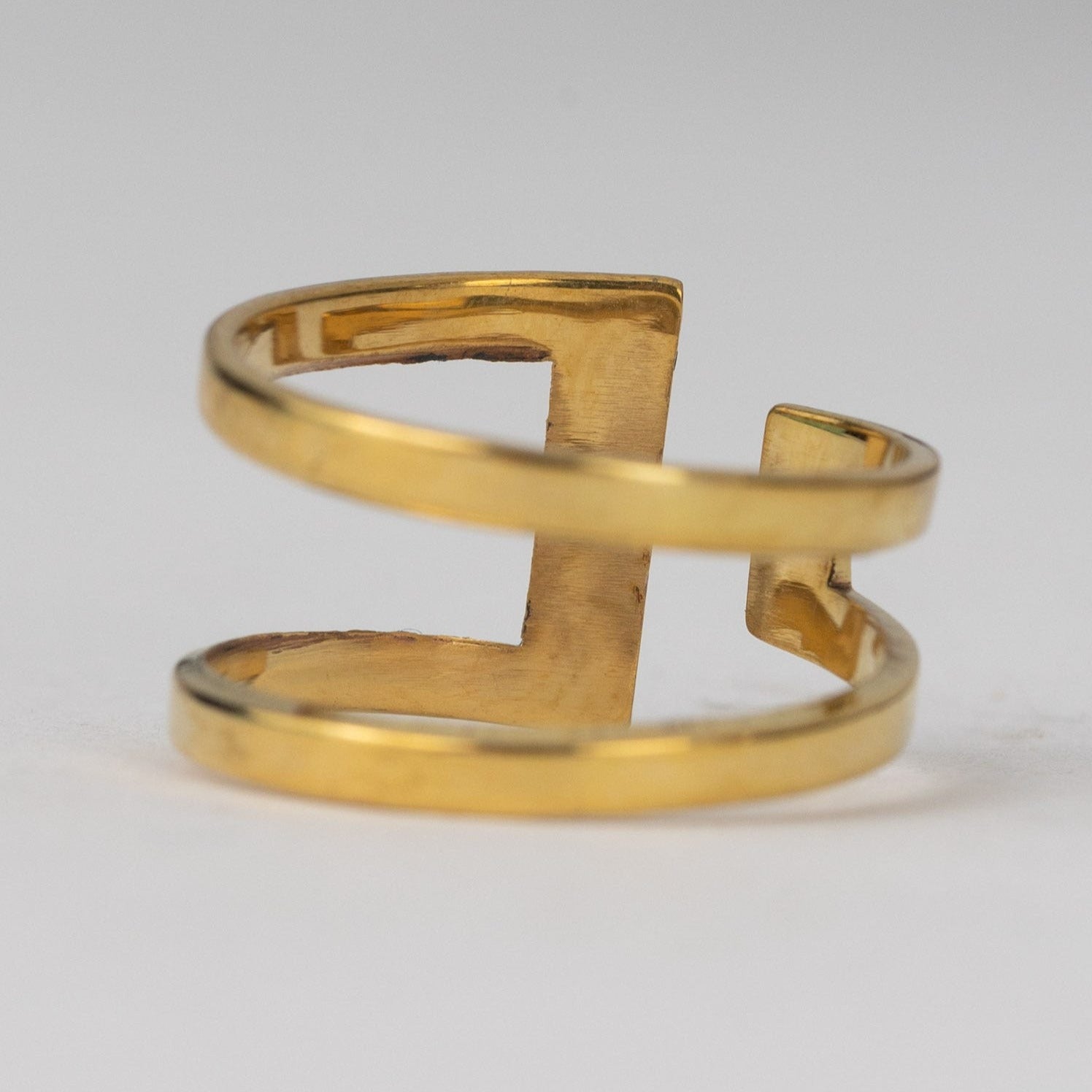Front view of handcrafted symbolic peace cuff ring made from recycled brass