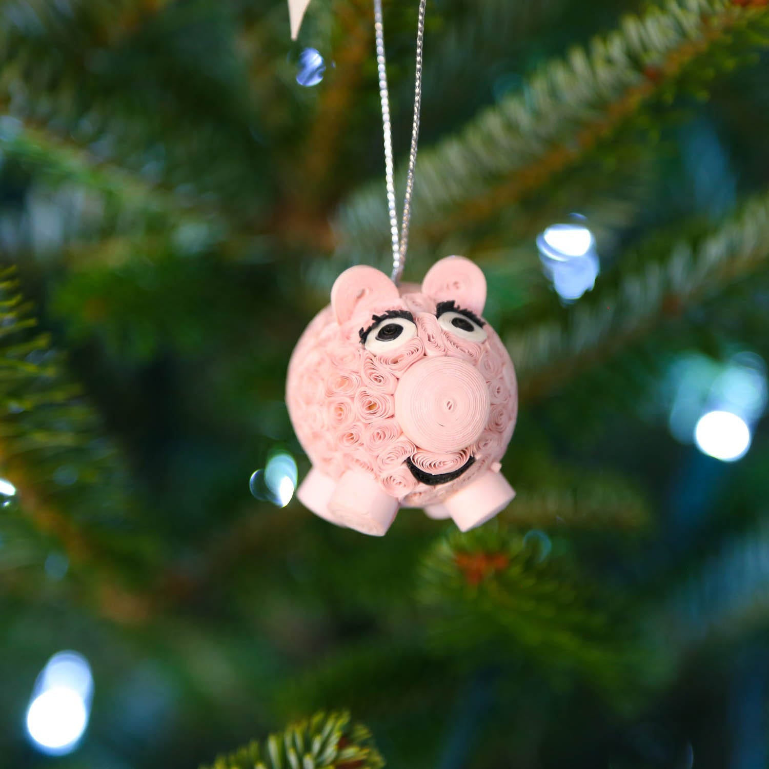 Charming Quilled Pig Ornament on a colorful background, perfect for home decor.
