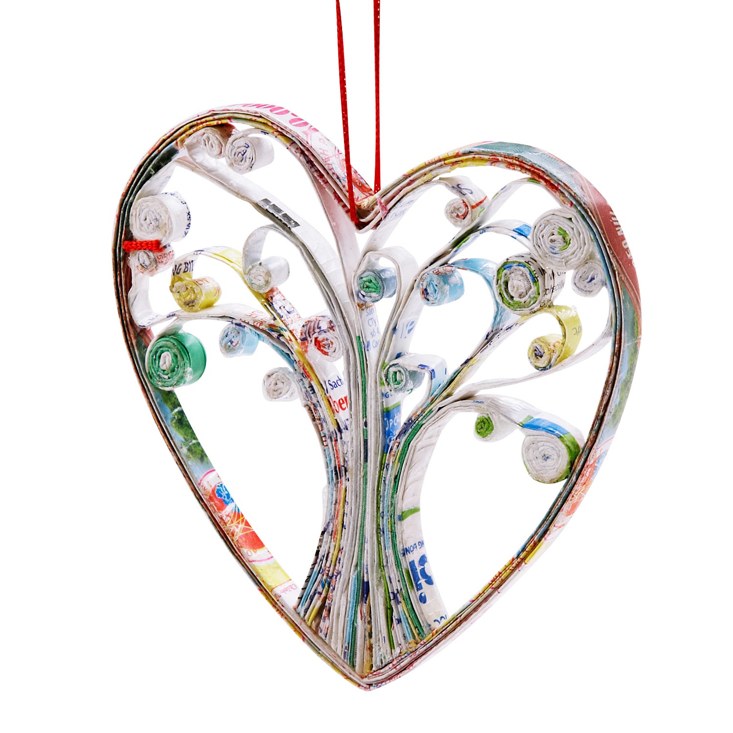 Close-up of recycled newspaper ornament hanging on a Christmas tree branch