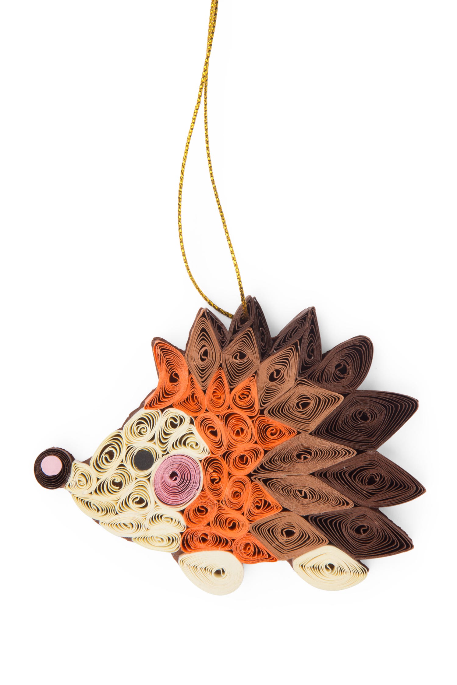 Close-up of handmade quilled hedgehog ornament hanging on a Christmas tree branch
