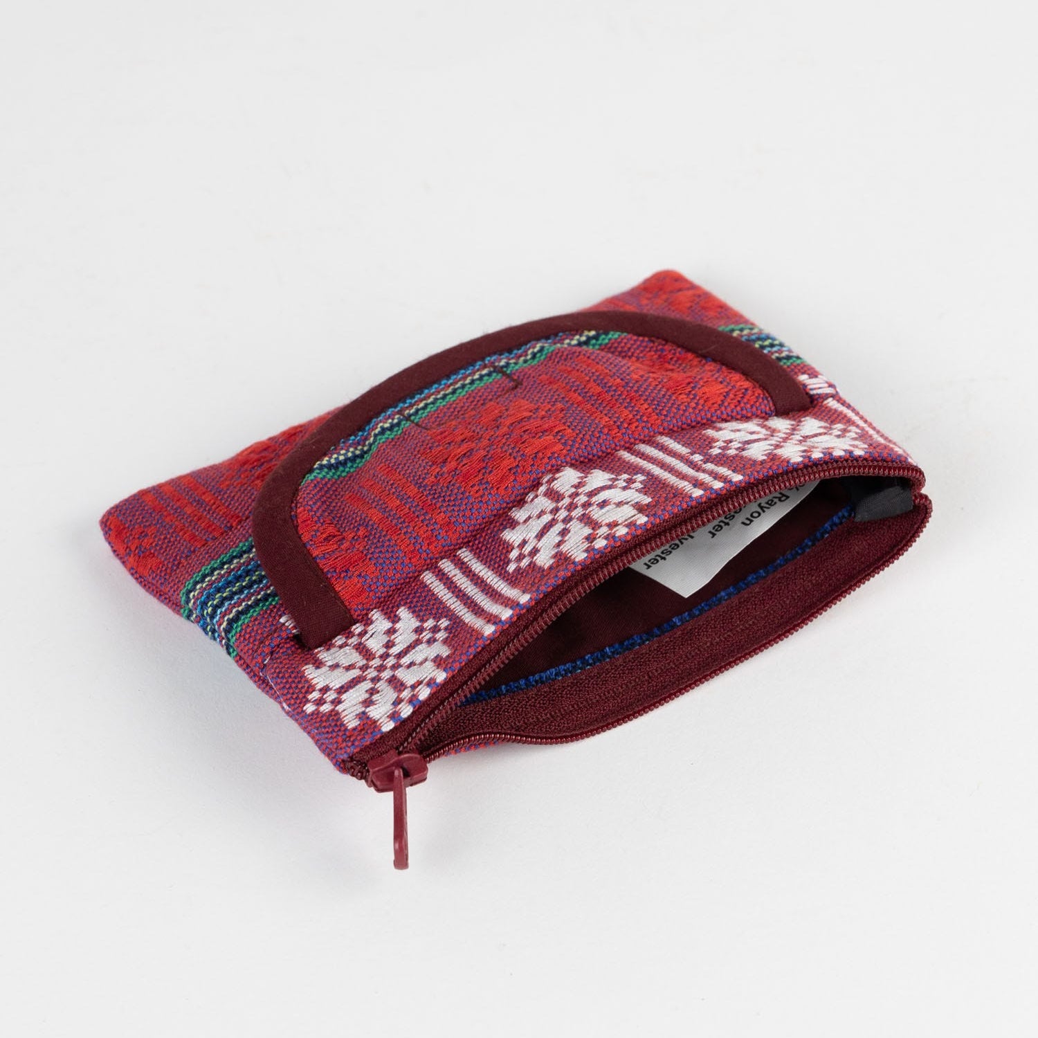 Charming red jacquard coin purse with zipper for coins, showcasing its pocket feature.