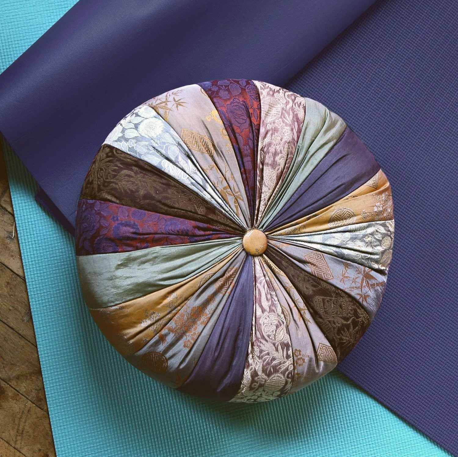 Luxury Mindfulness Cushion showcasing silk cover and natural kapok filling for ultimate comfort during meditation.