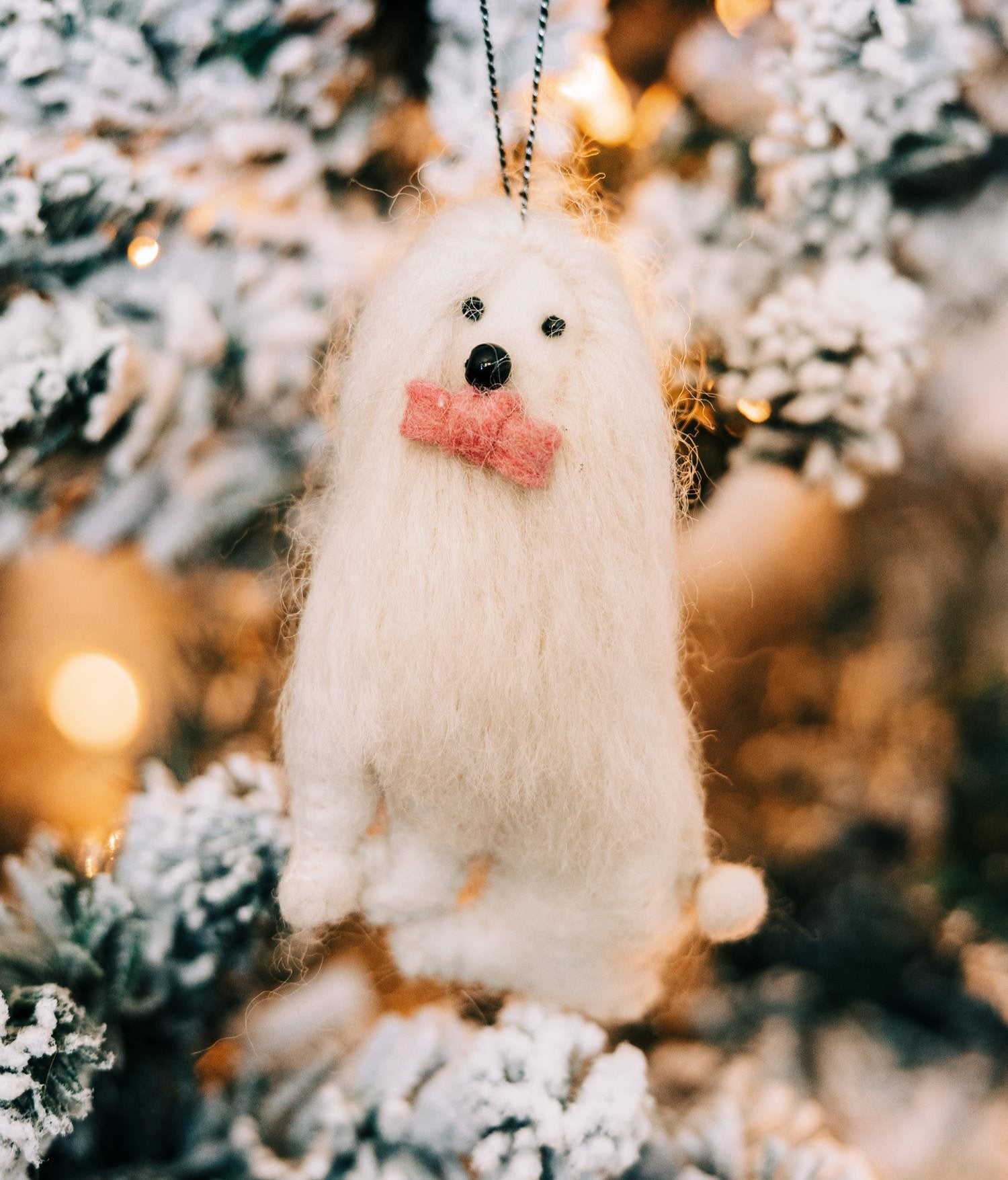 Front view of the handmade yeti dog ornament with a bowtie, perfect for tree decoration.