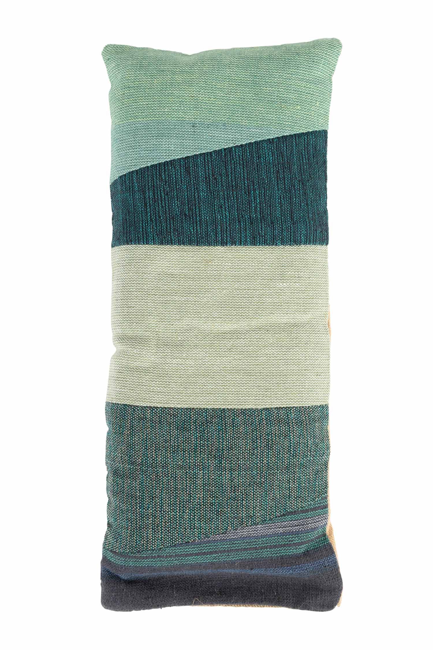 Close-up of handmade patchwork cotton eye pillow with natural textures