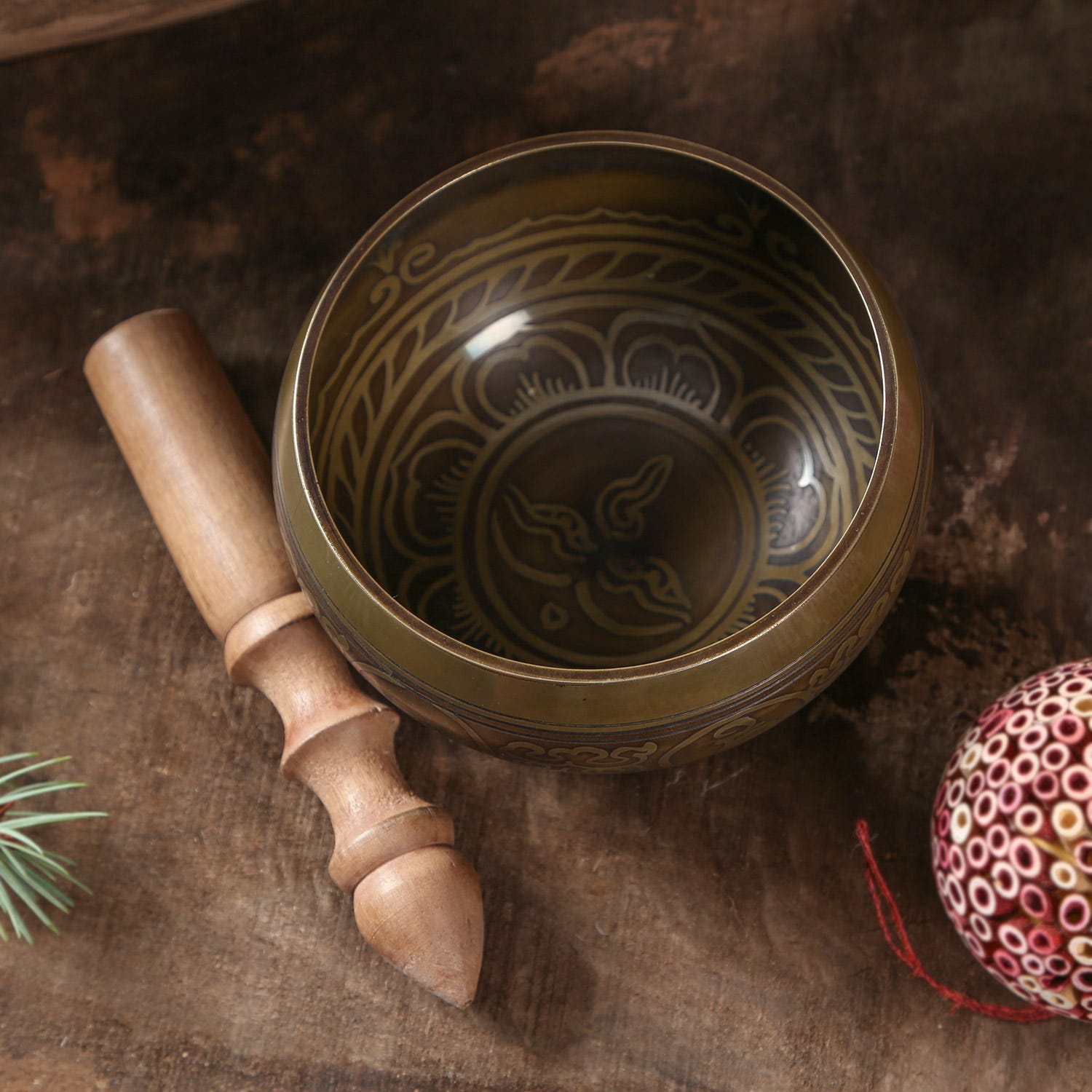 Close-up of inscribed brass singing bowl with Wisdom Eyes for meditation and stress relief