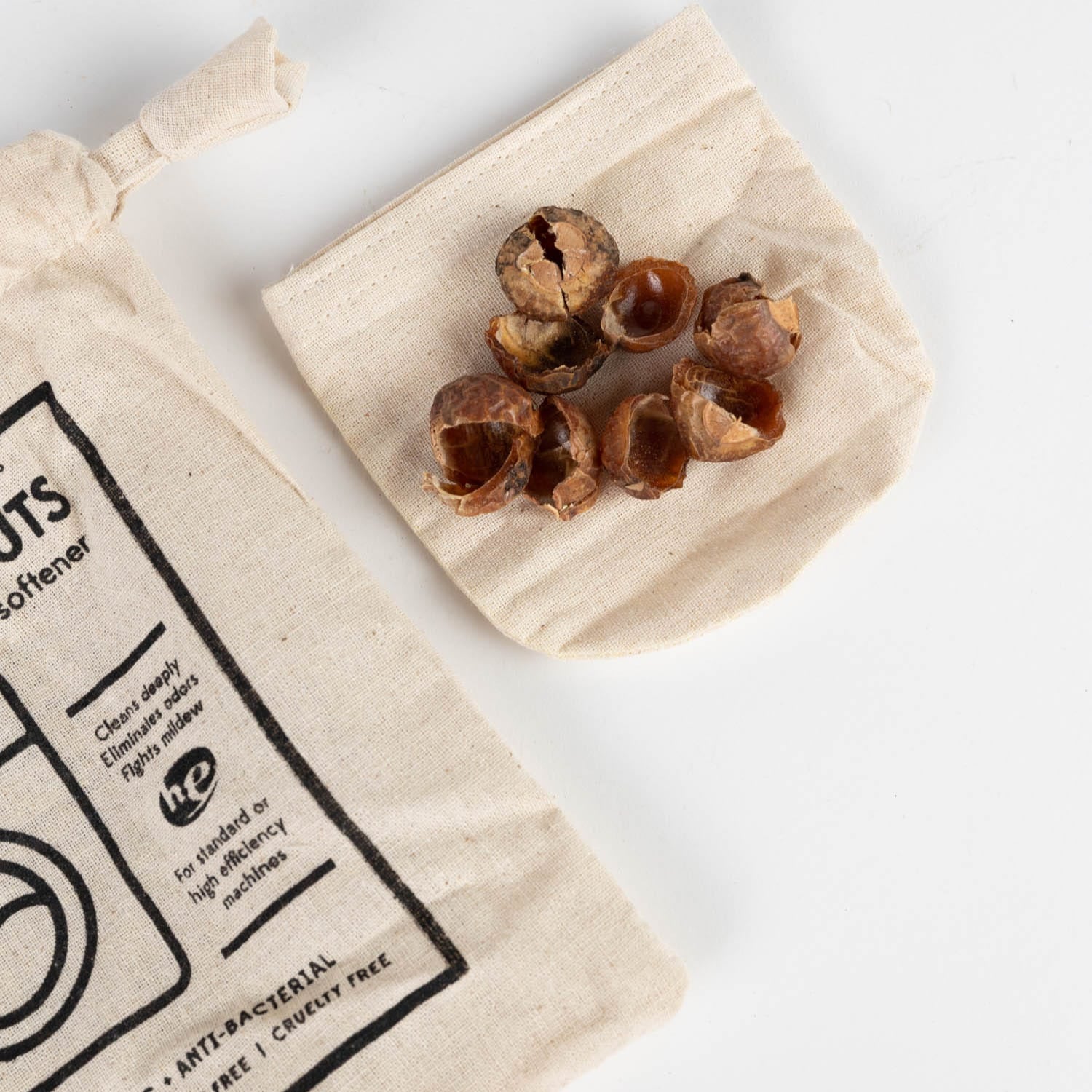 Close-up of eco-friendly soap nuts in a cotton bag, ideal for laundry