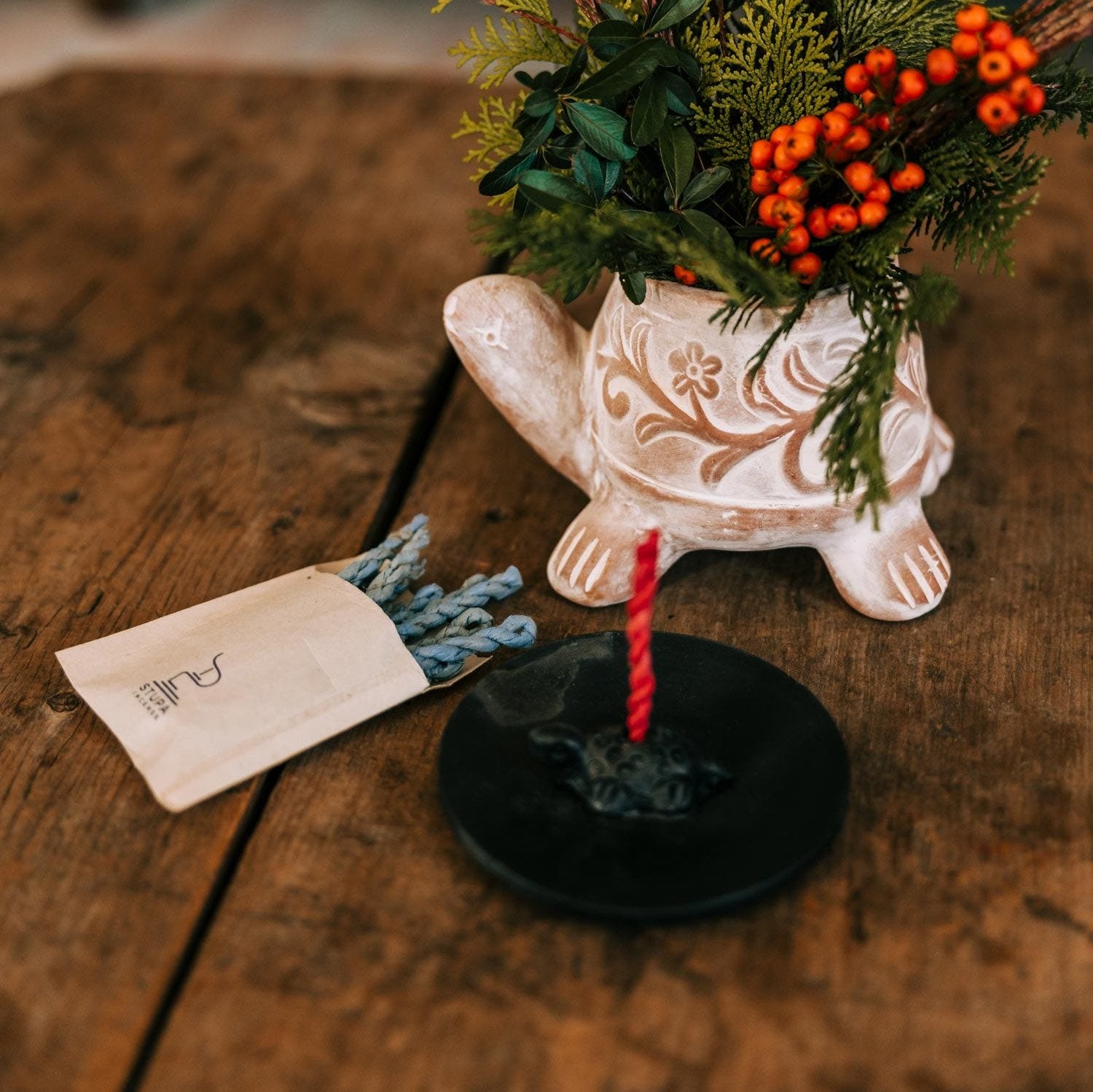 Close-up of turtle burner holding Nepal rope incense, ideal for meditation