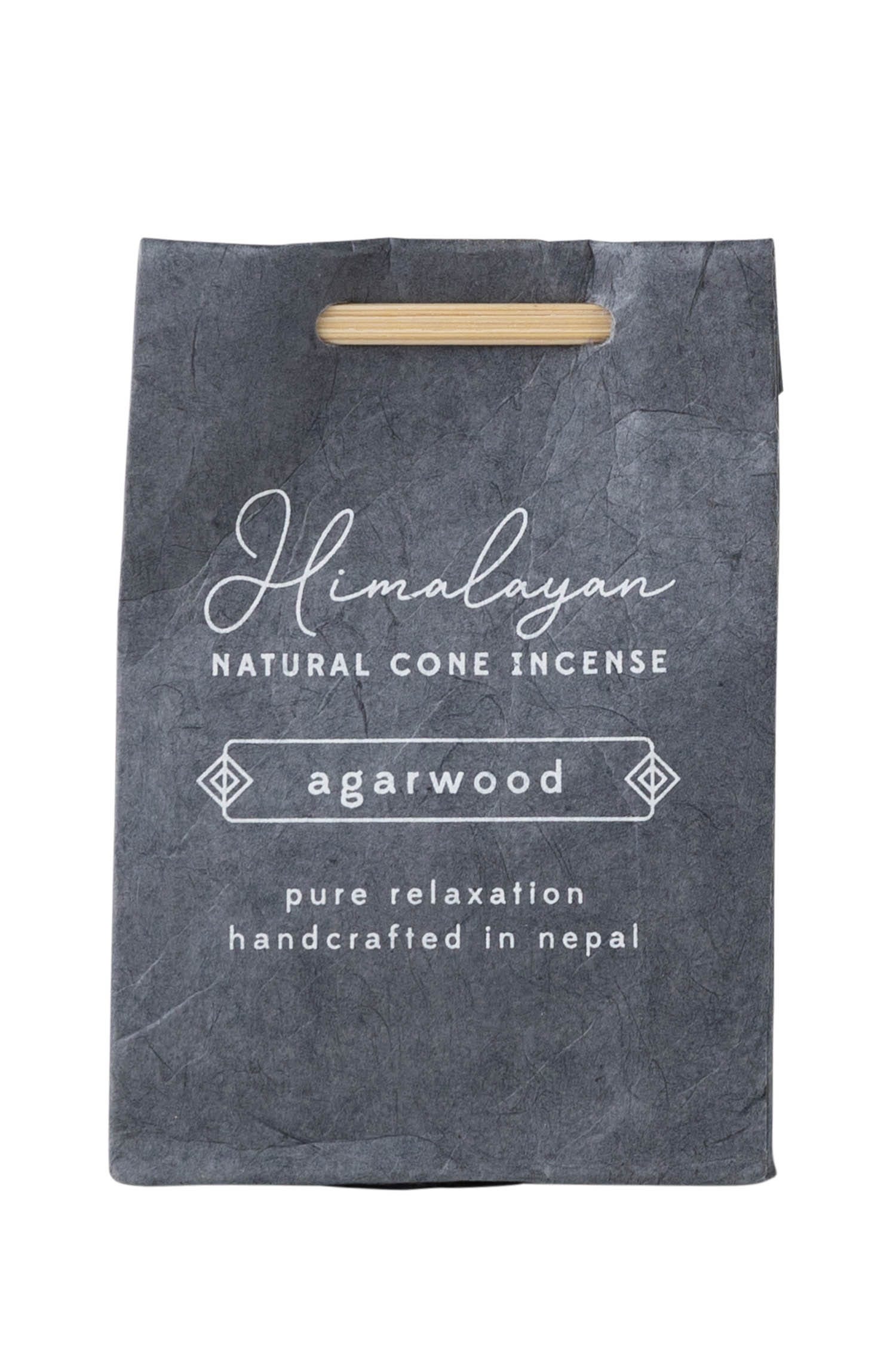 Close-up of Himalayan agarwood incense cones on a wooden surface, natural incense for meditation