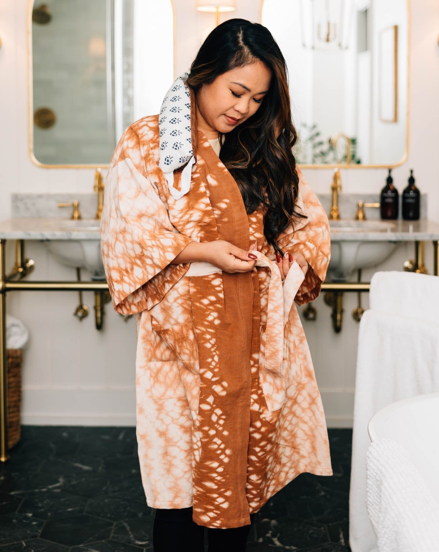 Front view of the Caramel Cloud kimono robe draped on a mannequin, showcasing its organic tie dye pattern
