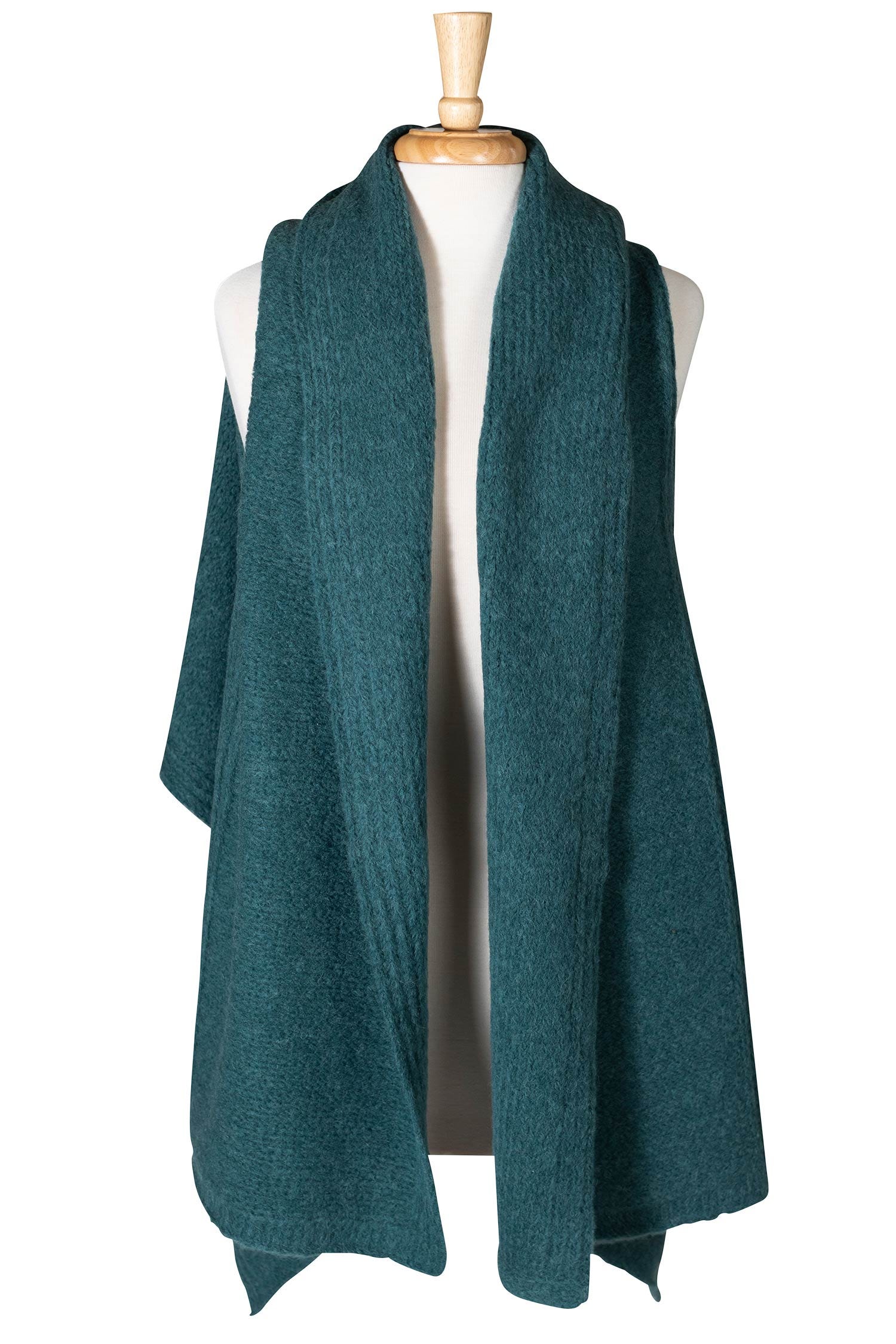 Close-up of teal handmade alpaca shawl with detailed weaving
