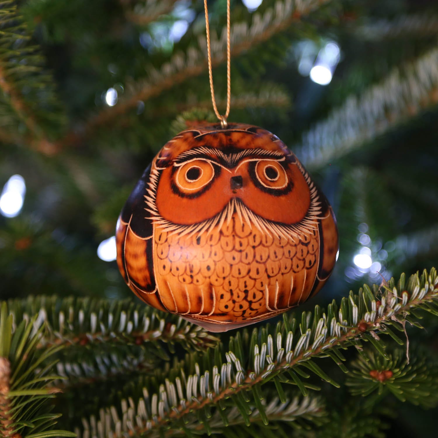 Handcrafted gourd owl ornament with detailed carvings and vibrant accents.