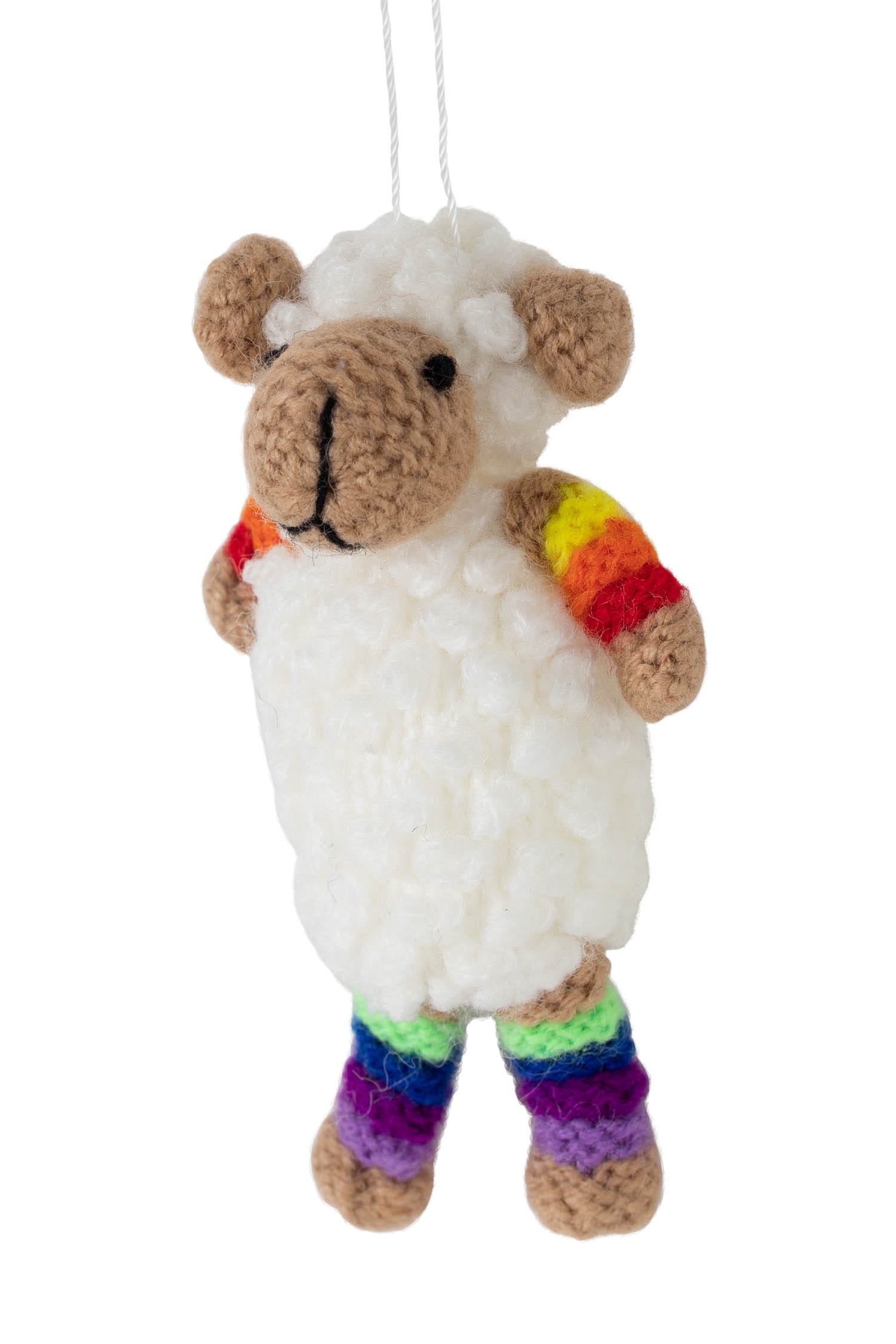 A charming crocheted sheep ornament hanging on a Christmas tree, showcasing its intricate details.