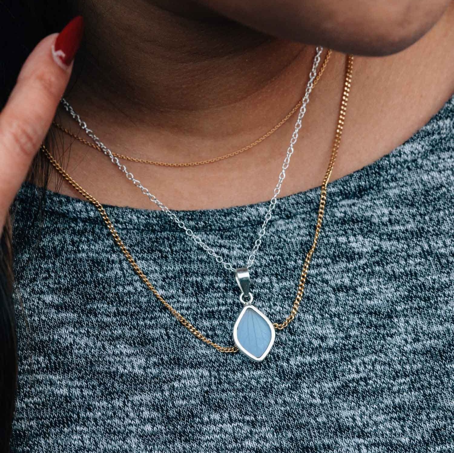 Close-up of artisan glass petal necklace showing the real flower detail