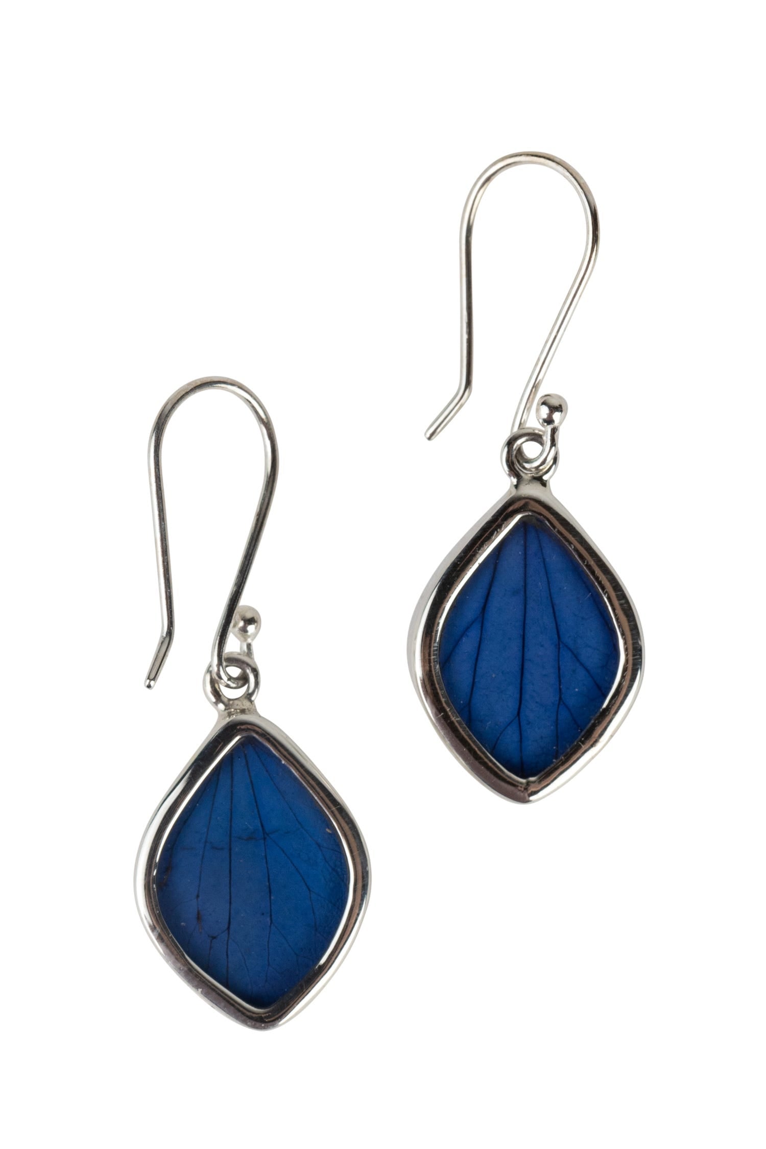 Artisan blue petal earrings displayed on a model showing the design and color.
