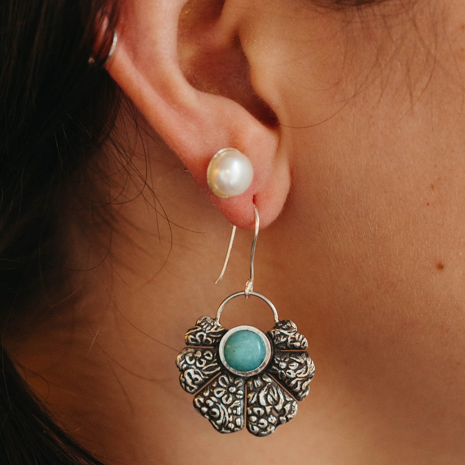 Close-up of Amazonite fan earrings with sterling silver accents, showcasing the intricate design and gemstone detail