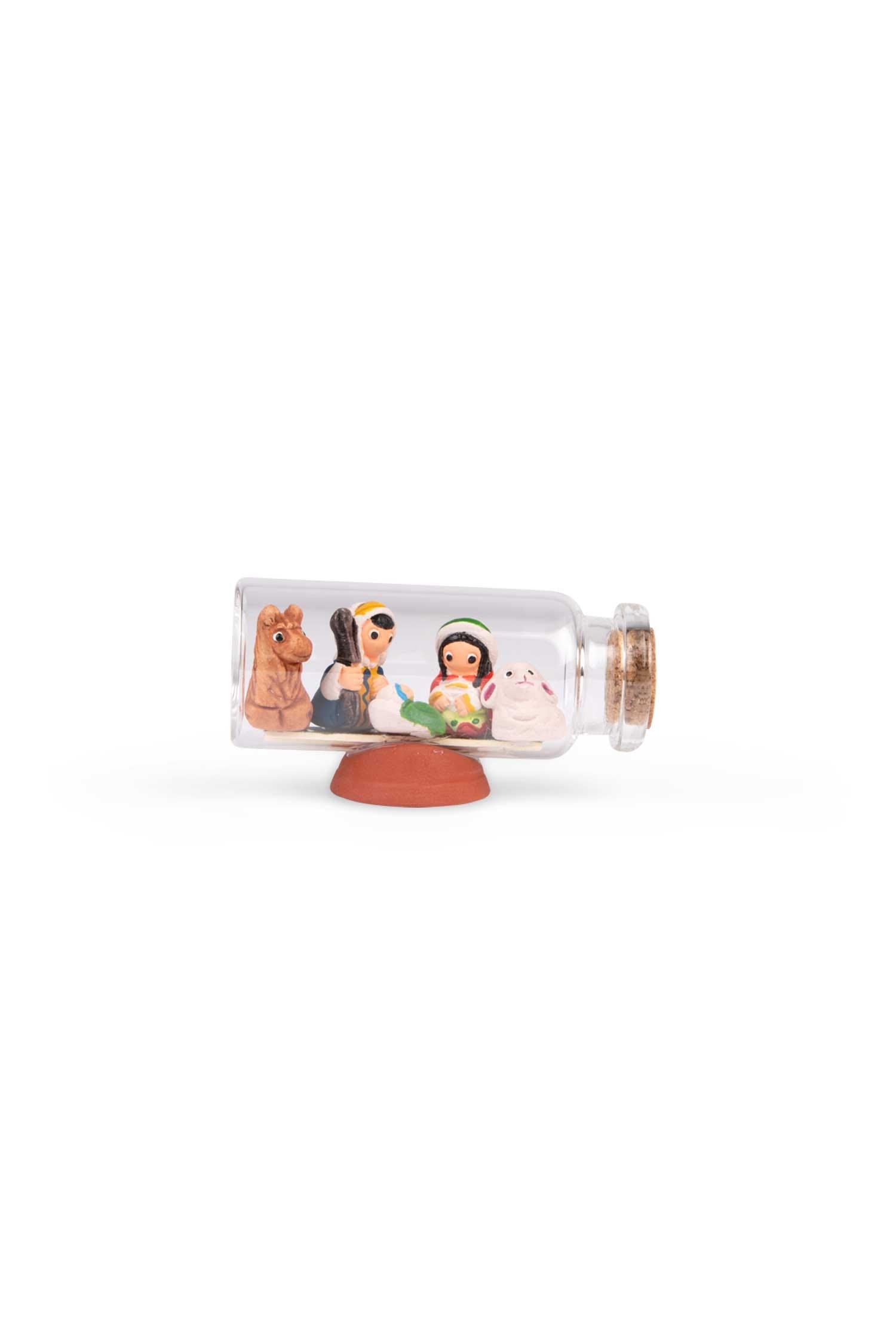 Close-up of the charming mini nativity set displayed on a festive mantle, highlighting its intricate craftsmanship.