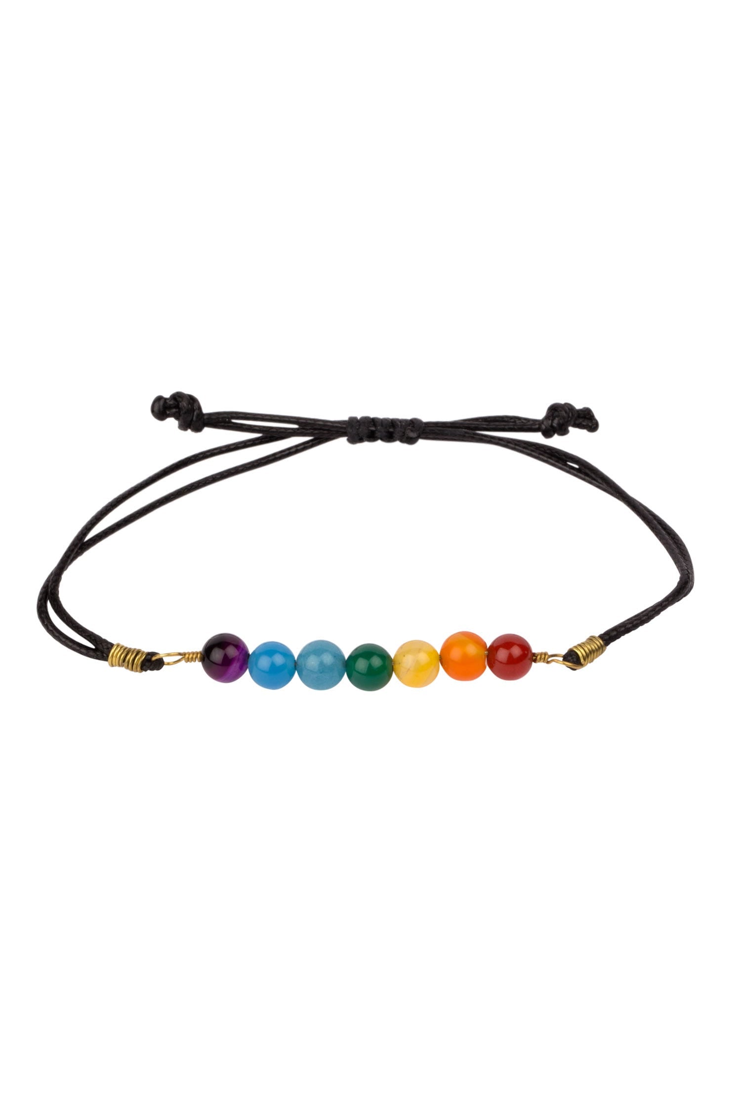 Vibrational Energy Harmony Bracelet displayed on a wooden surface, highlighting its colorful stones.