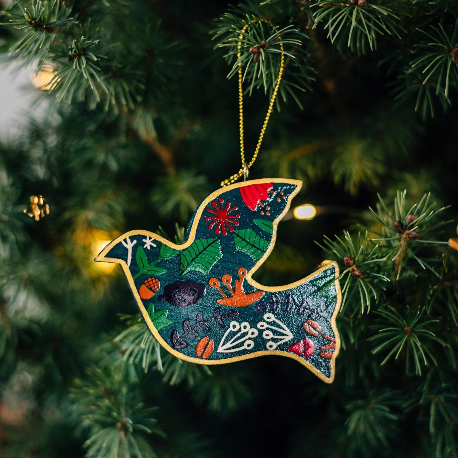Floral dove ornament showcasing vibrant colors and intricate details, perfect for home decor.