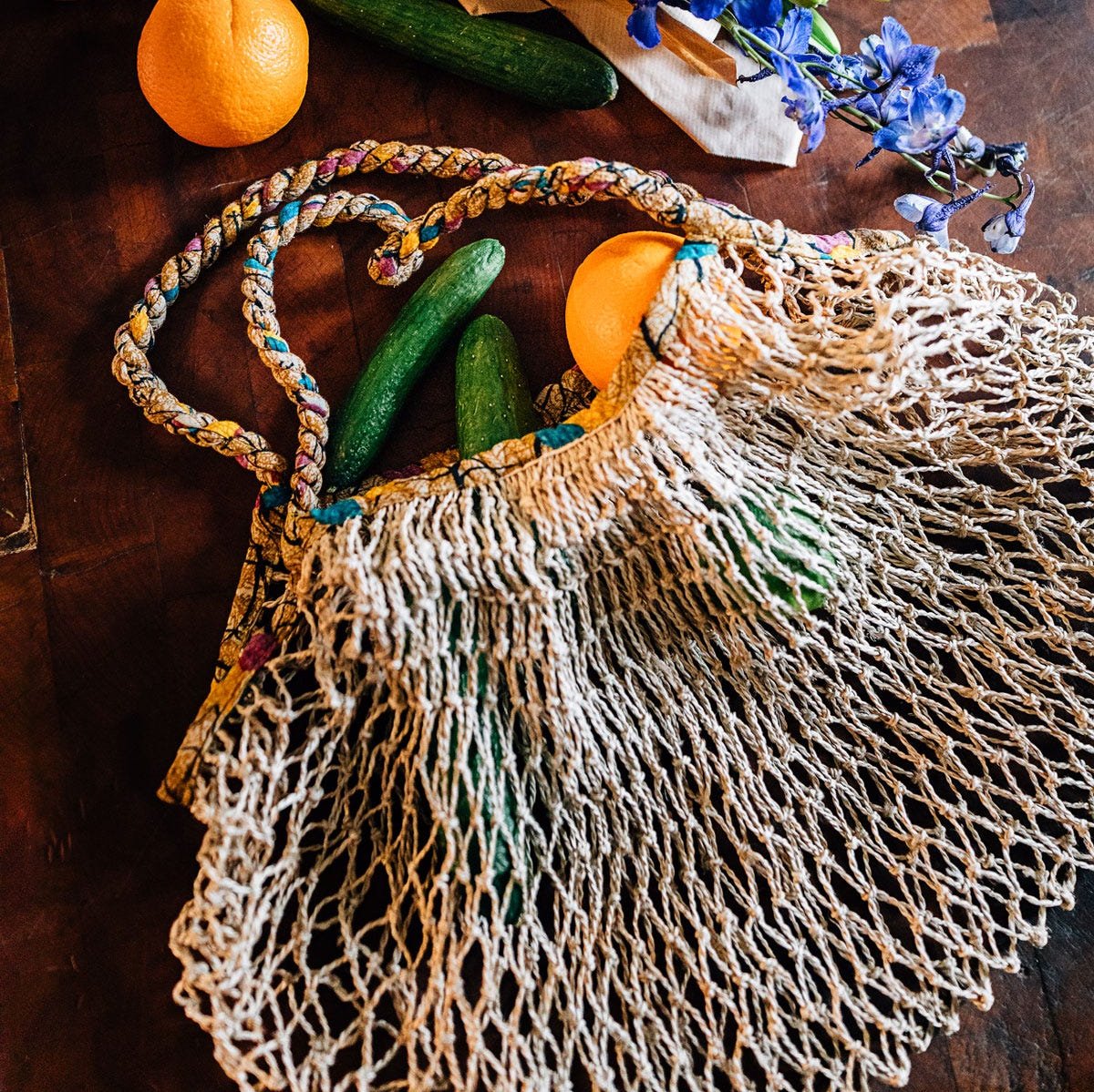 Eco-friendly sari and jute shopping tote filled with fresh produce