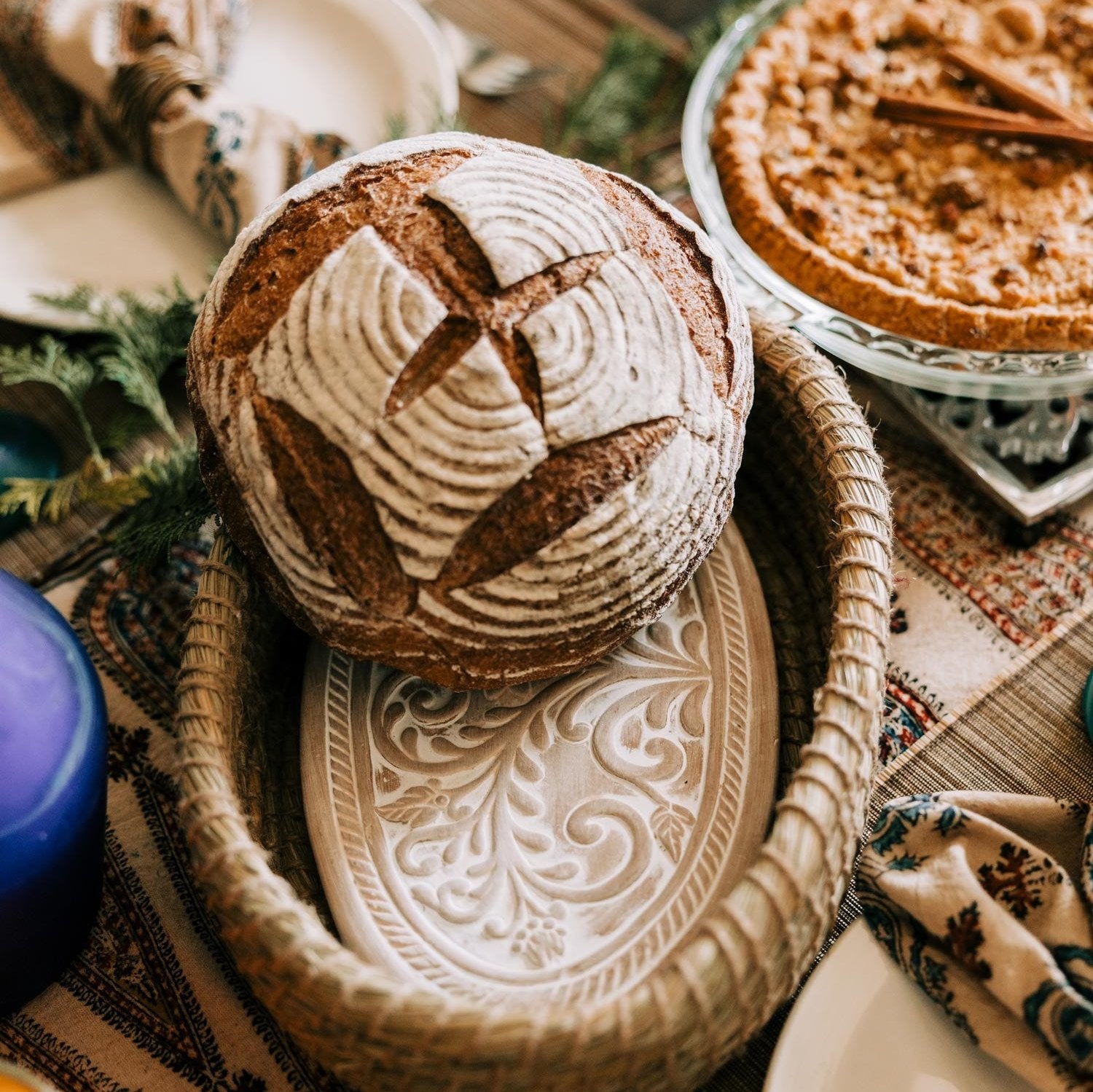 Close-up of handcrafted terracotta bread warming insert in basket