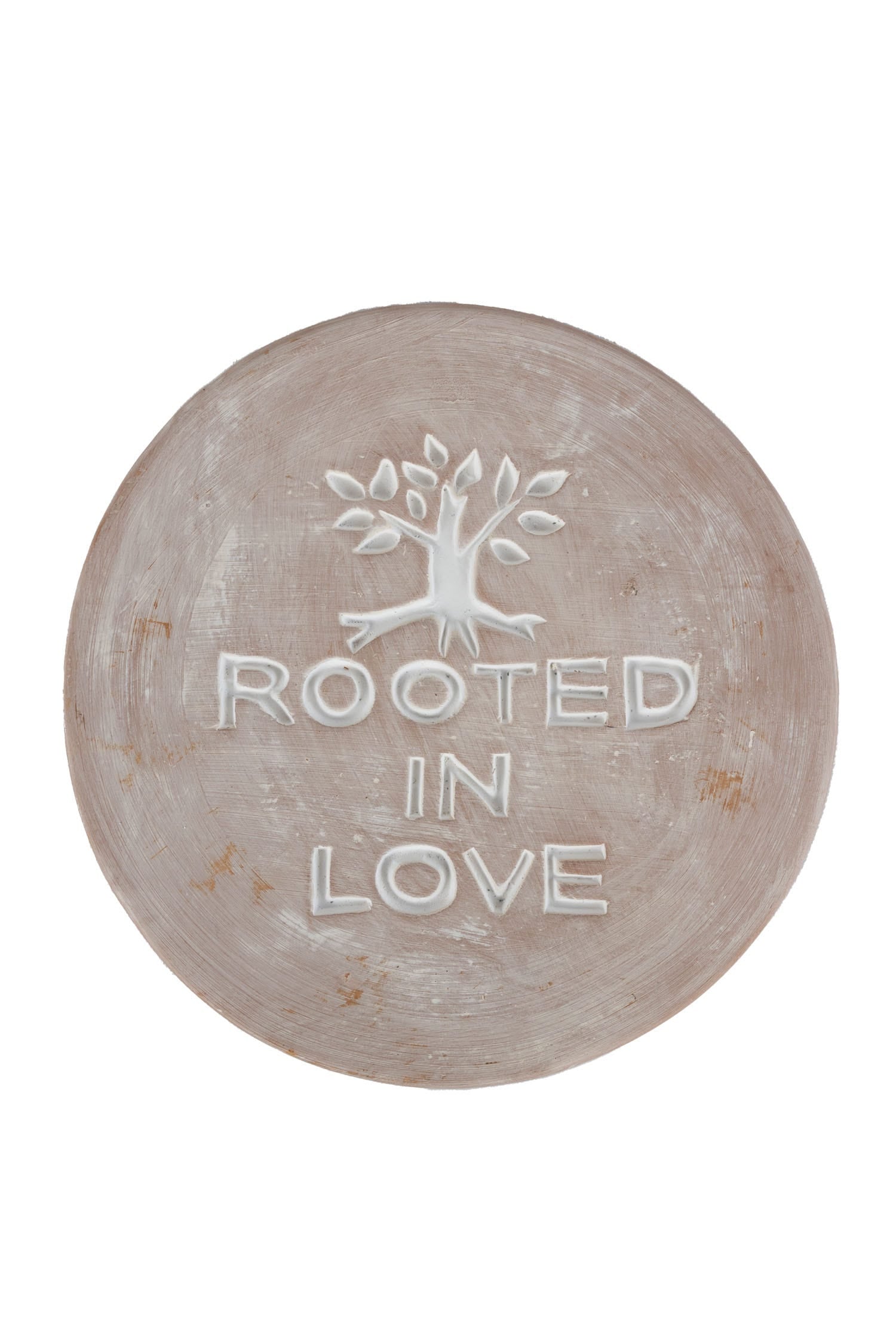 Heartfelt Connection terracotta plaque displayed in a vibrant garden setting, showcasing its unique design.