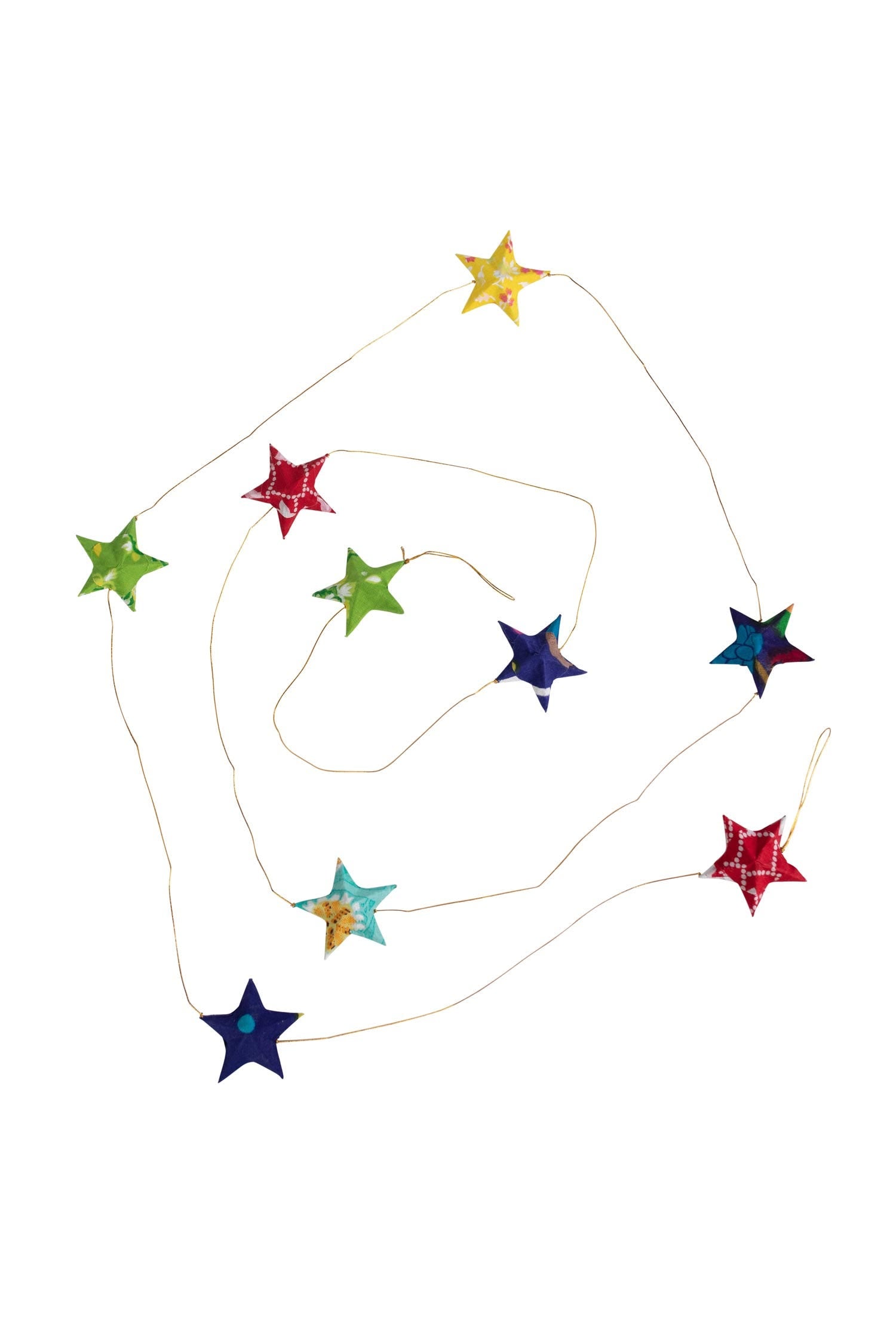 Close-up of handcrafted recycled sari star garland for eco-friendly decor